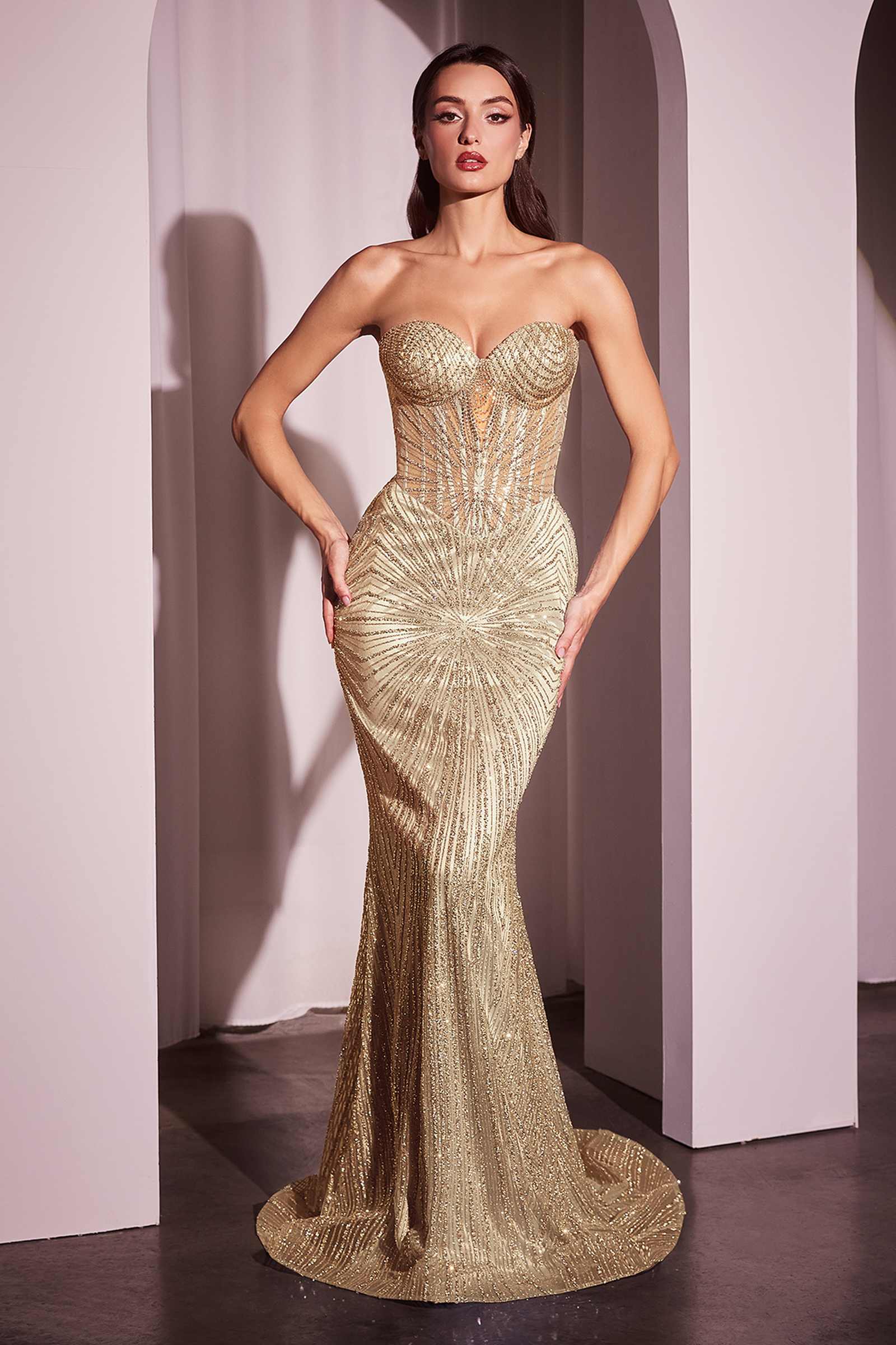 Gold strapless fitted long gown with sweetheart neckline and ruched bodice