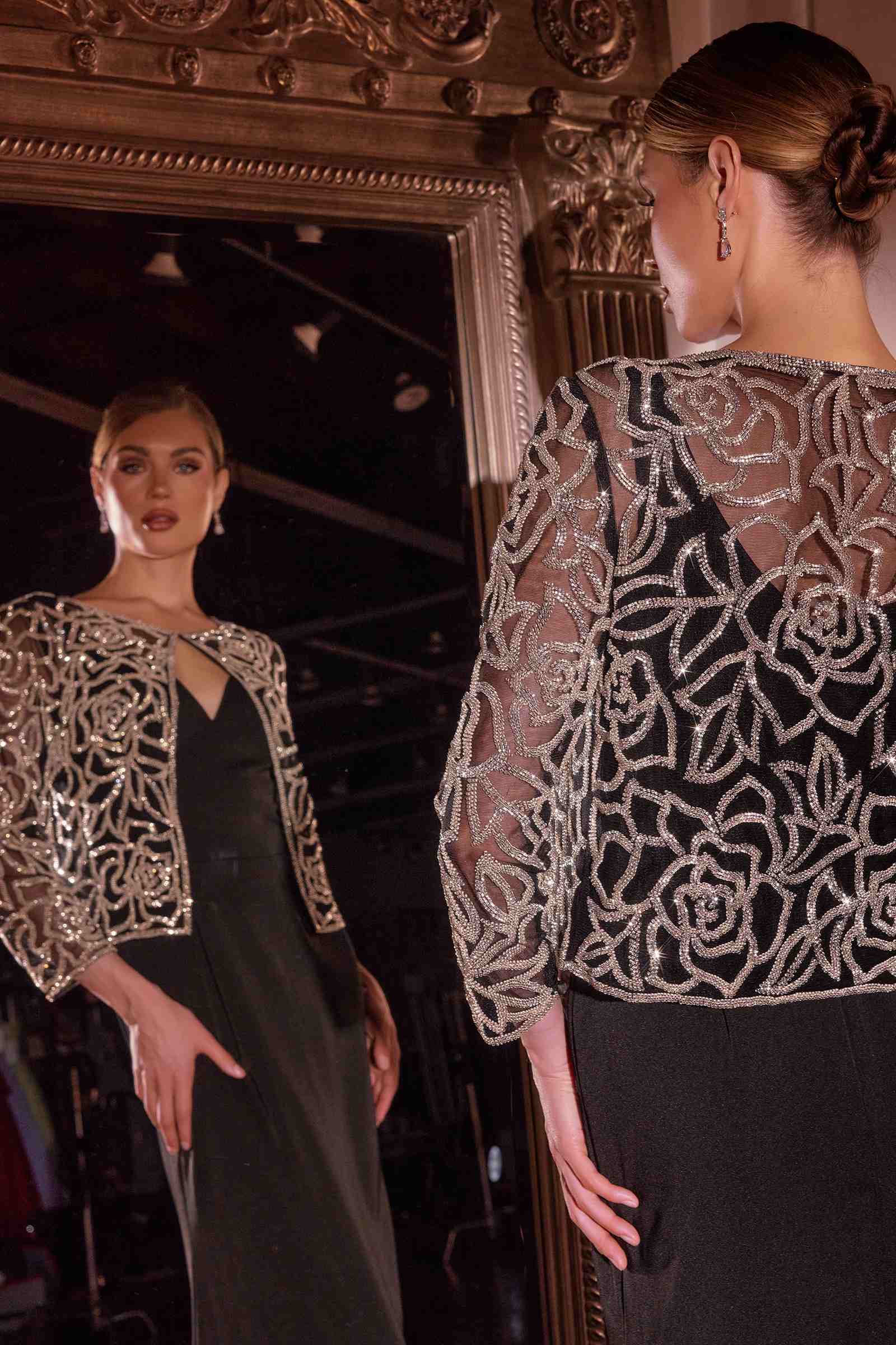 Back view black crepe gown with removable silver beaded jacket and V-neck cutout
