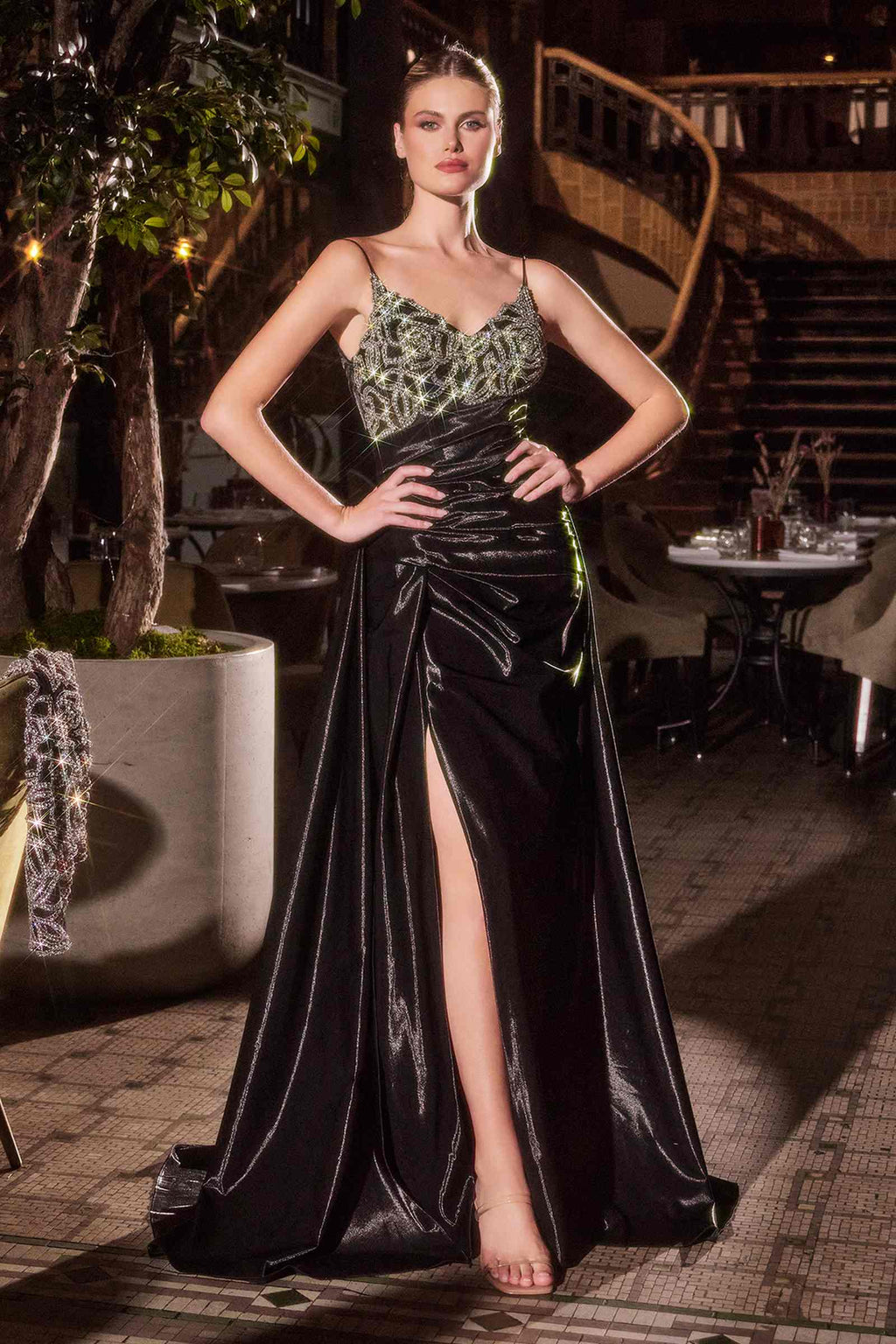 Black formal gown with beaded V neckline, spaghetti straps, front thigh slit