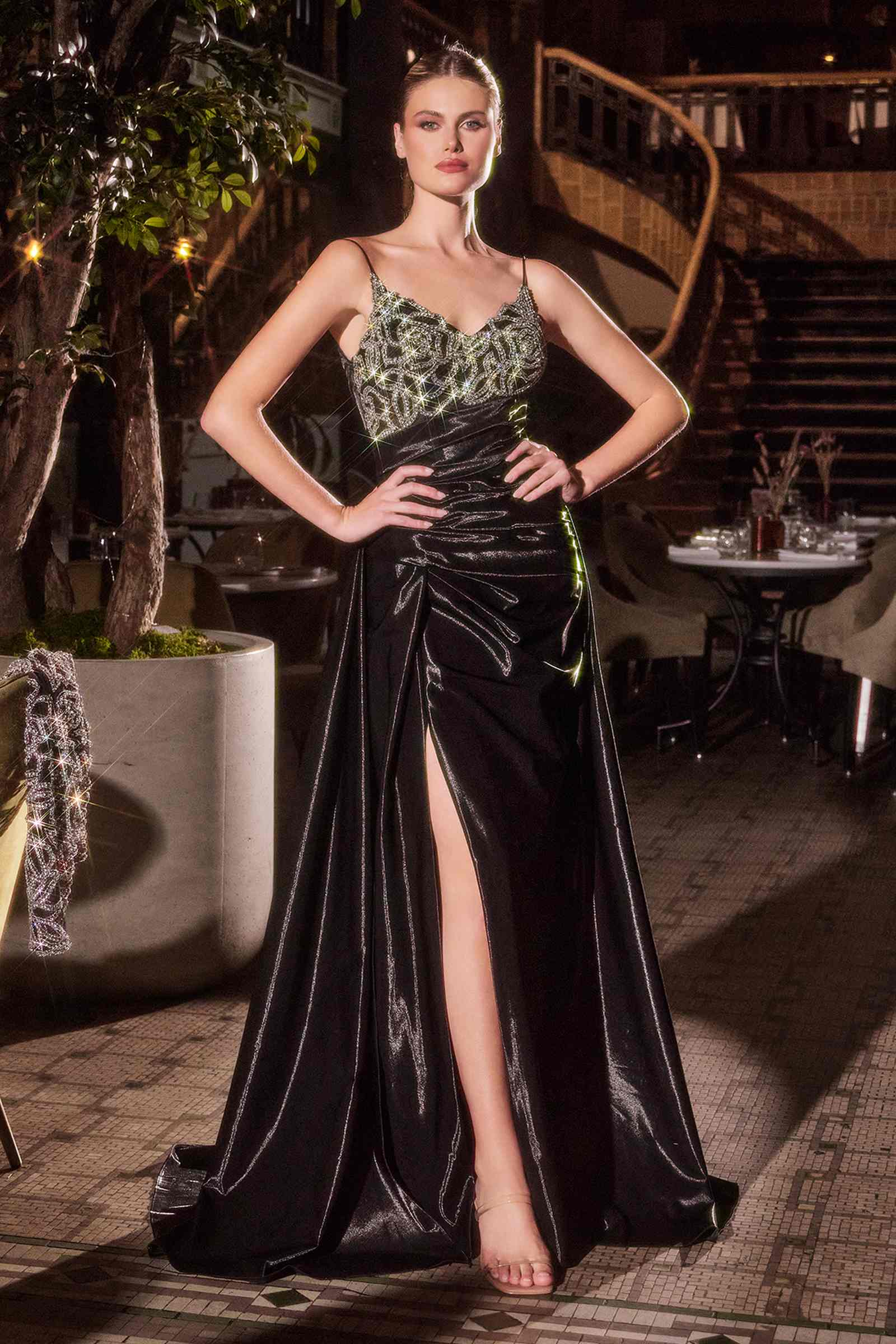 Black formal gown with beaded V neckline, spaghetti straps, front thigh slit
