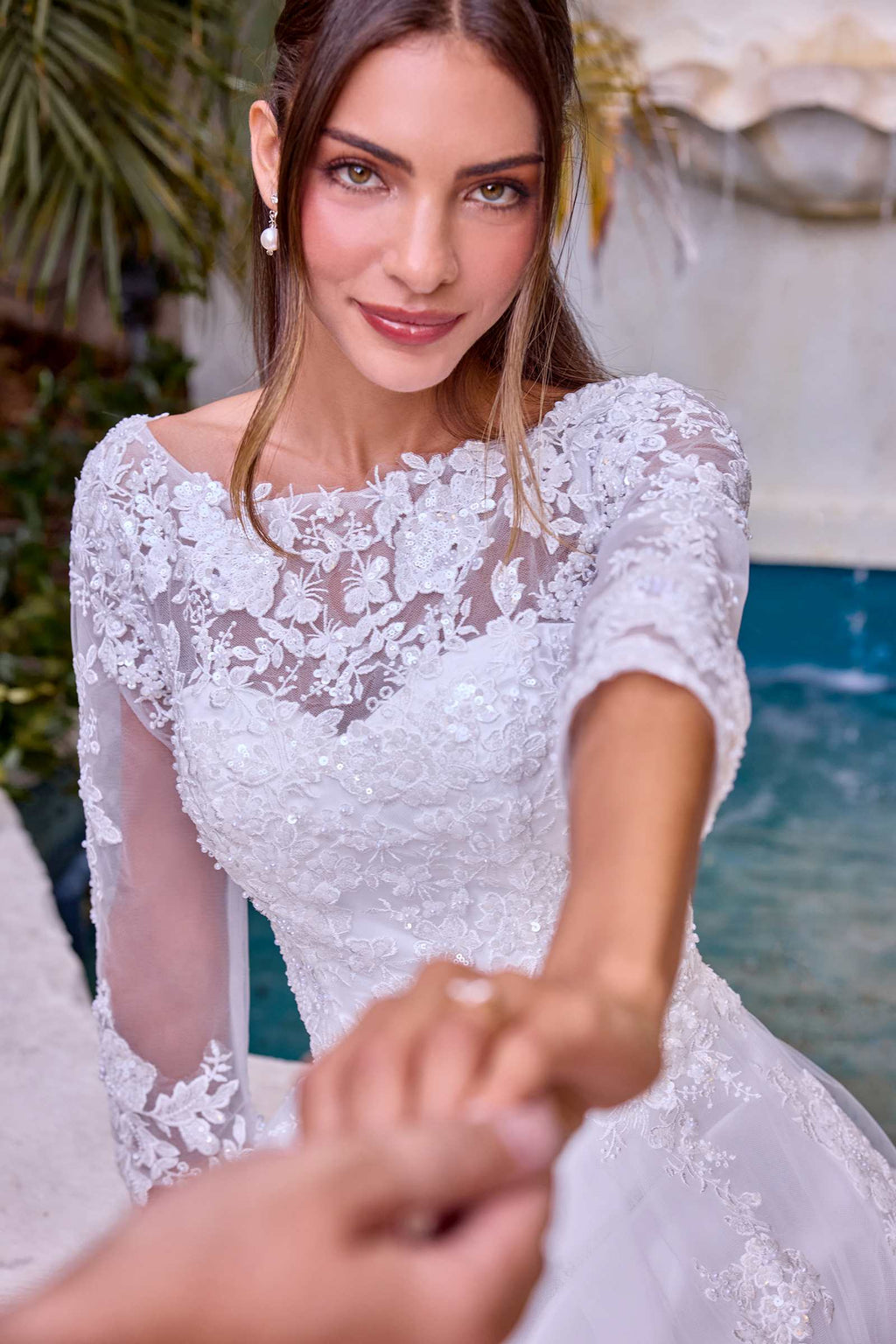 Off-white lace wedding bodice with floral appliqué and sheer long sleeves
