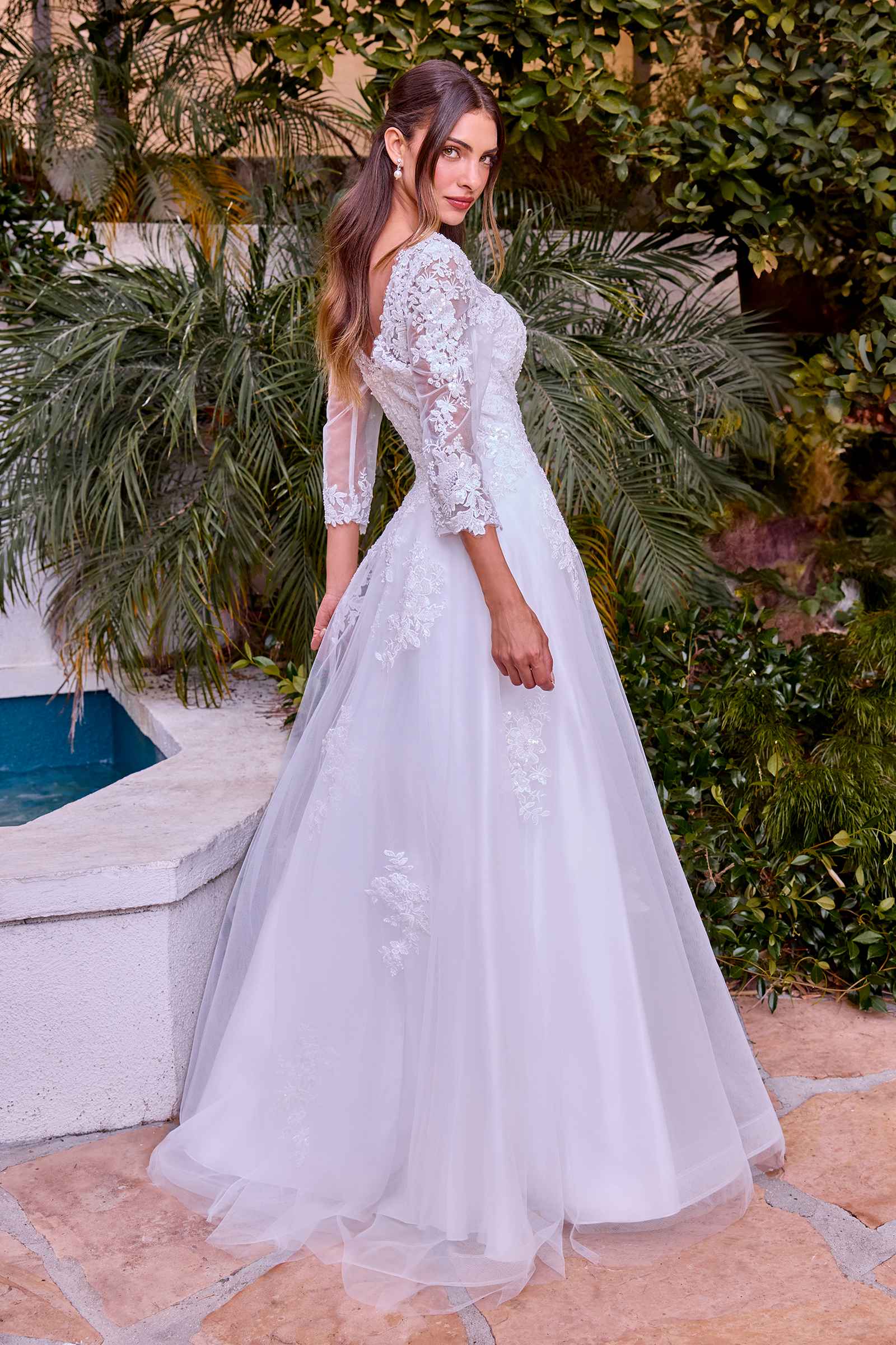 Off-white A-line wedding ball gown with sheer long sleeves and scattered lace appliqué