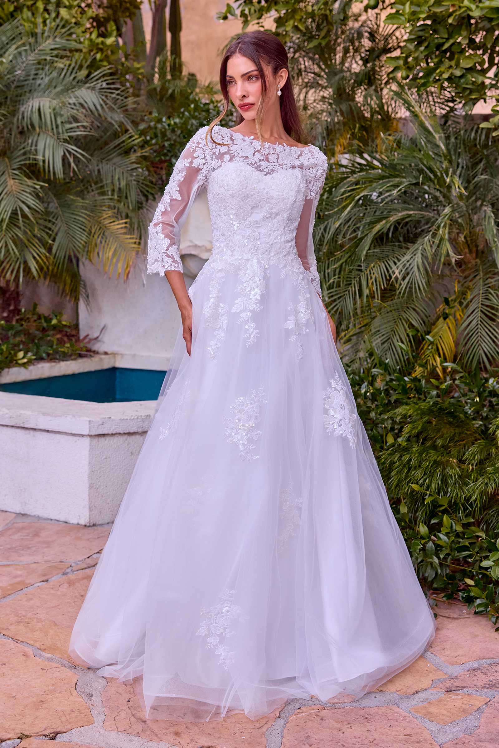 Off-white wedding A-line ball gown with long lace sleeves and lace appliqué bodice