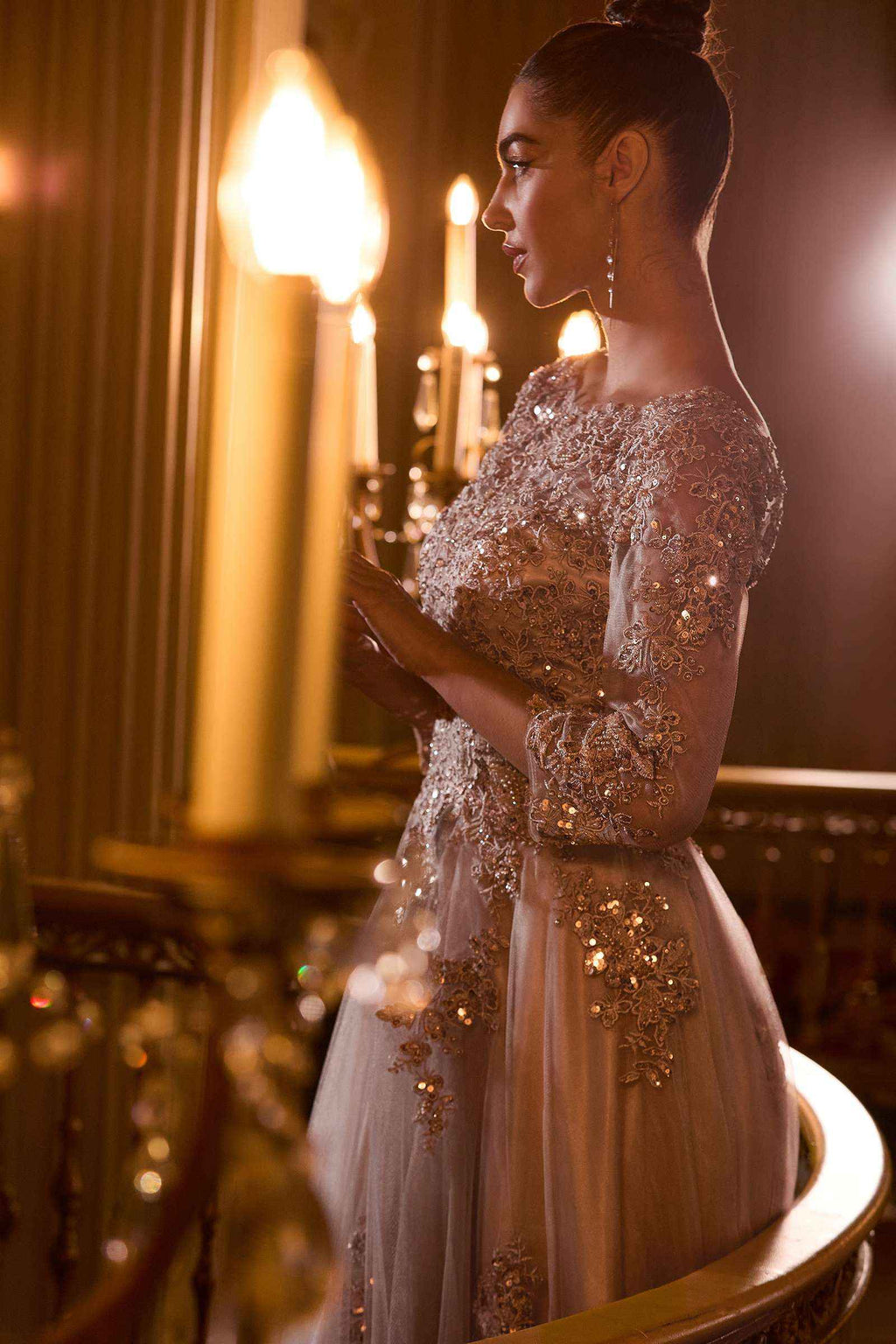 Sparkly champagne-gold wedding A-line ball gown with lace appliqué and long sheer sleeves