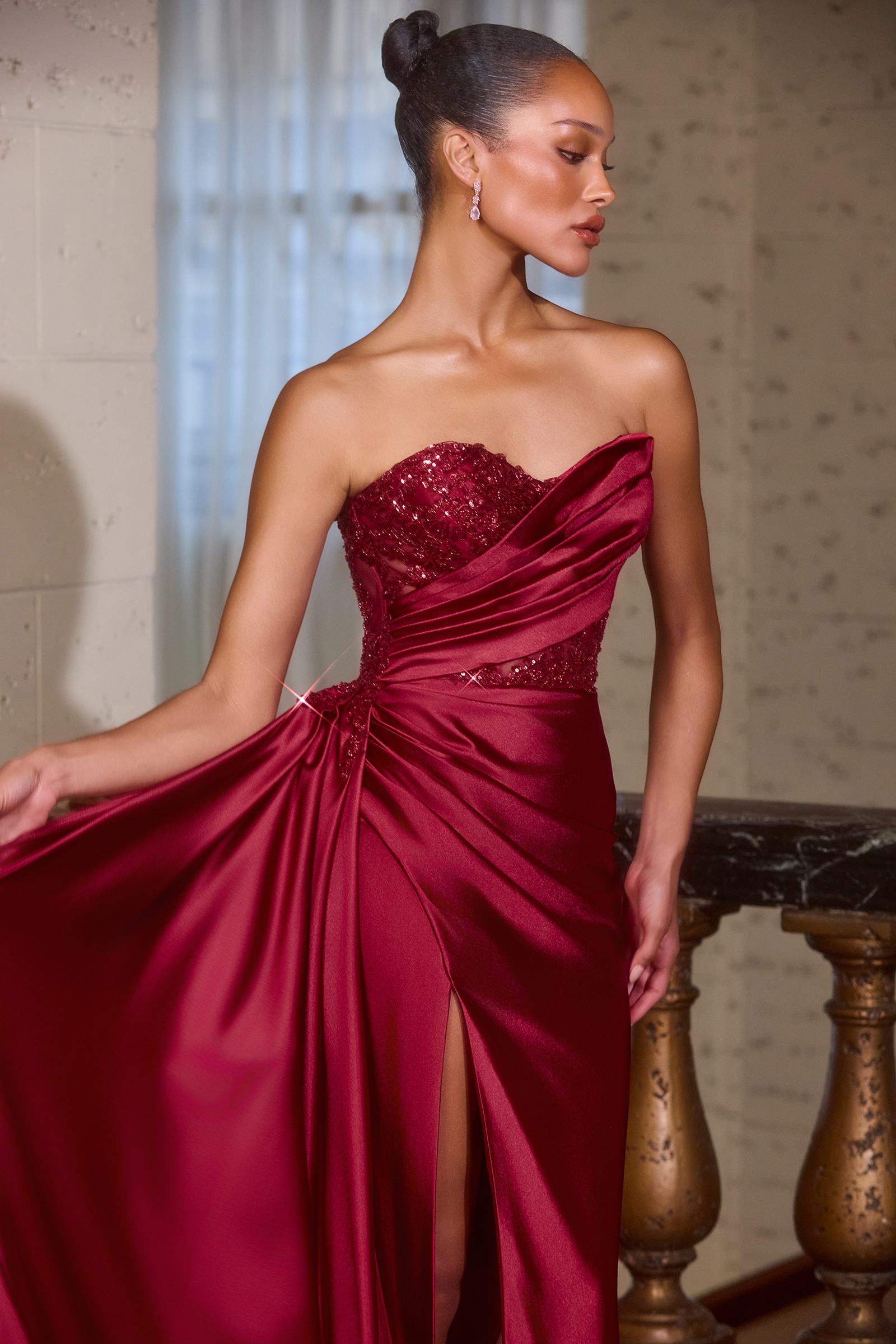 Burgundy strapless evening gown with sweetheart neckline, ruched waist and draped skirt