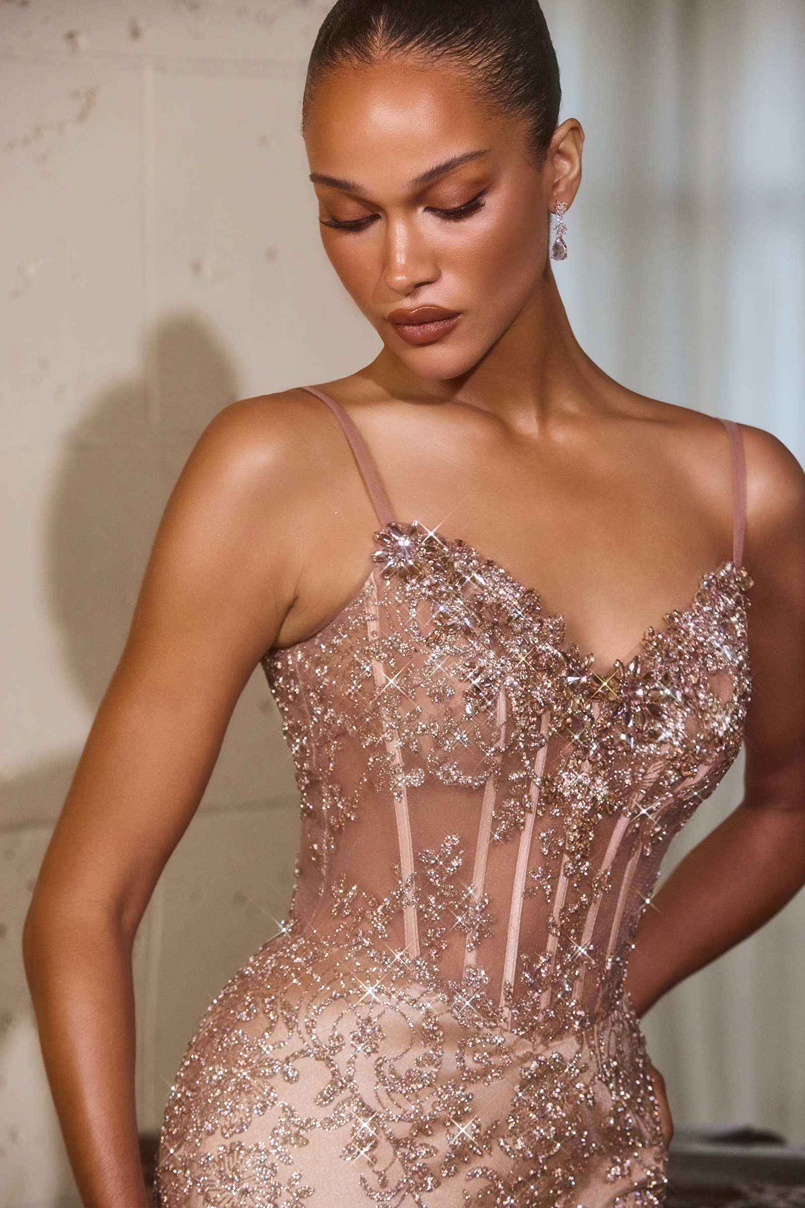 Rose gold sequin bodice with hand-placed applique and sweetheart neckline fitted gown