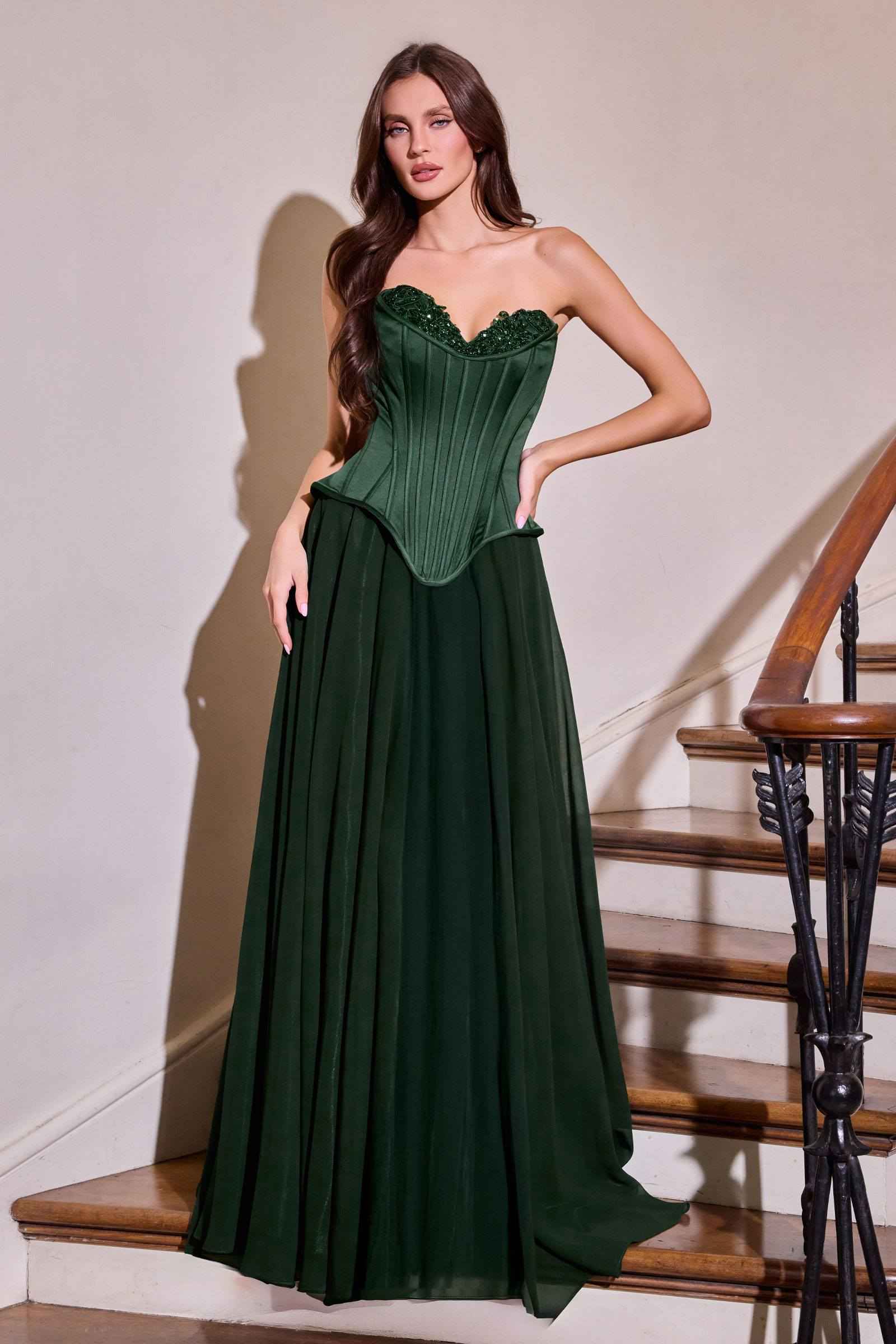 Green fitted corset bodice gown with sweetheart neckline and long flowing skirt