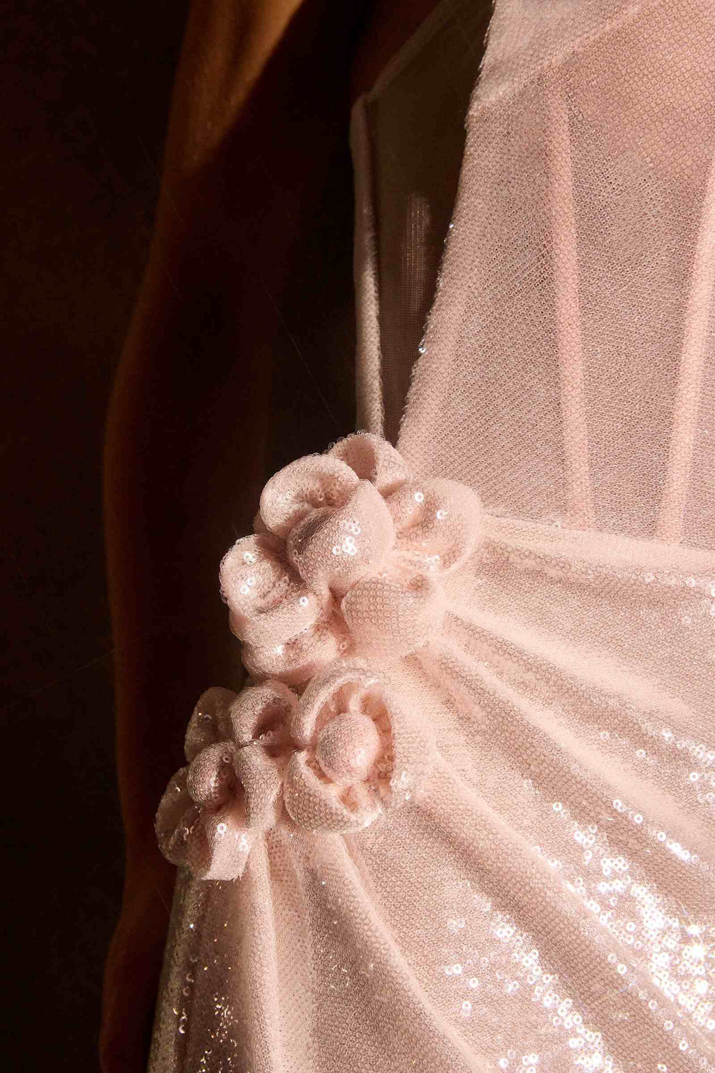 Strapless blush sequin gown with floral applique and illusion side mesh