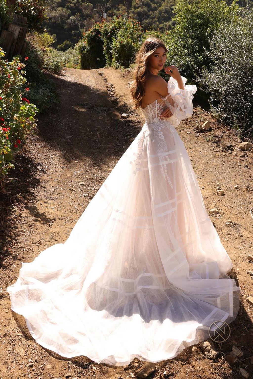 White A-line bridal gown with strapless sweetheart bodice, tulle puff sleeves, flared tiered skirt
