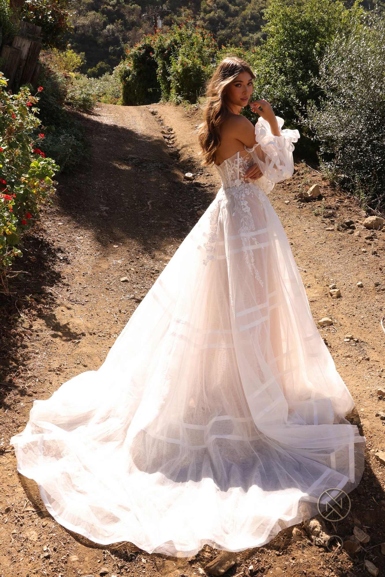 White A-line bridal gown with strapless sweetheart bodice, tulle puff sleeves, flared tiered skirt