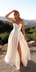 White strapless bustier corset gown with sweetheart neckline and front slit