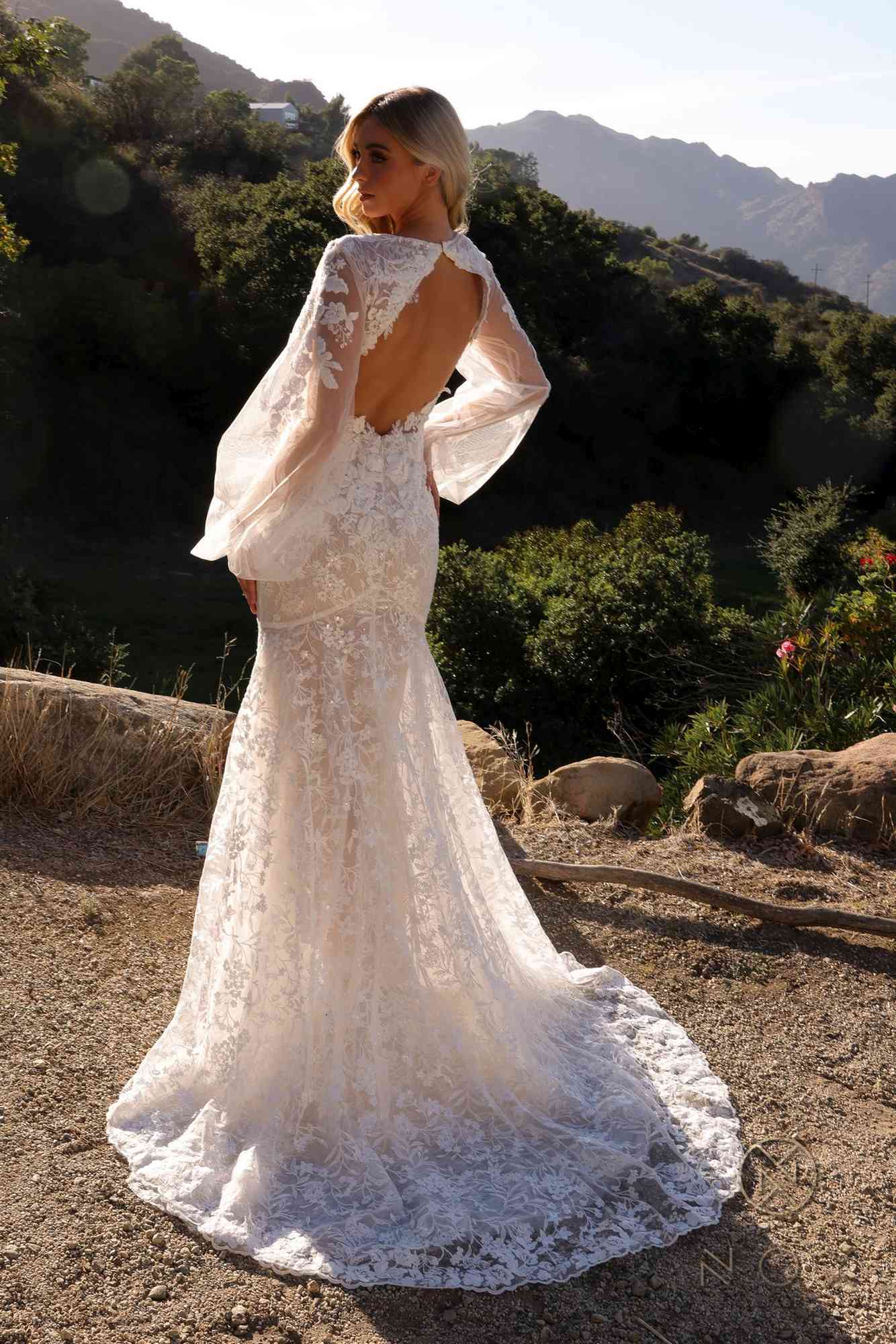 White bridal mermaid lace dress with open back detail, long puff sleeves