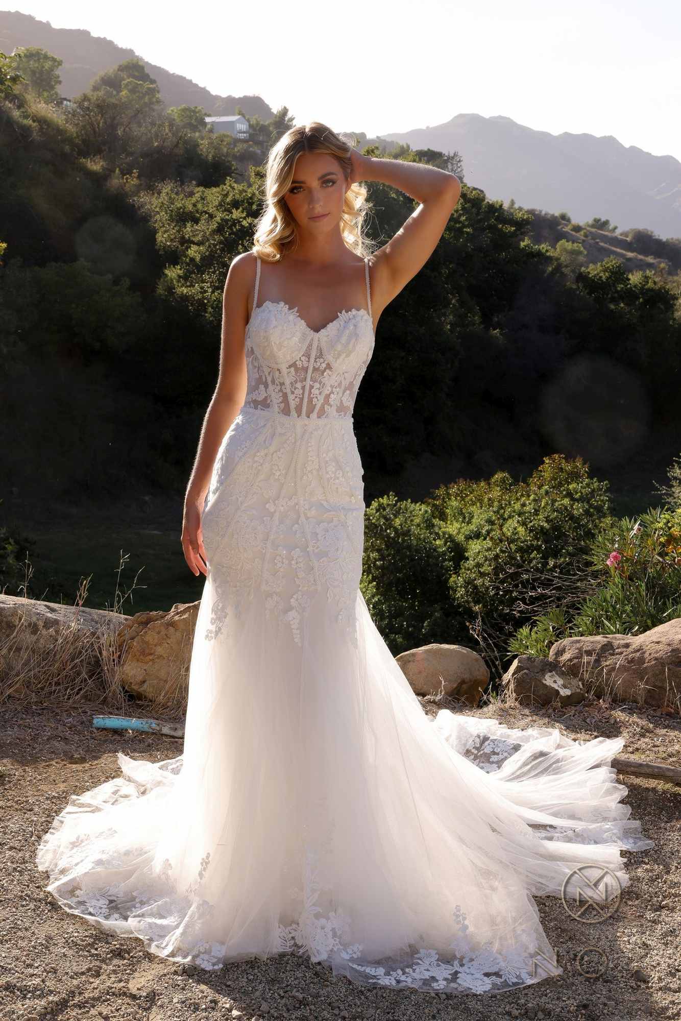 White sleeveless mermaid bridal dress with lace applique bodice and long flared skirt
