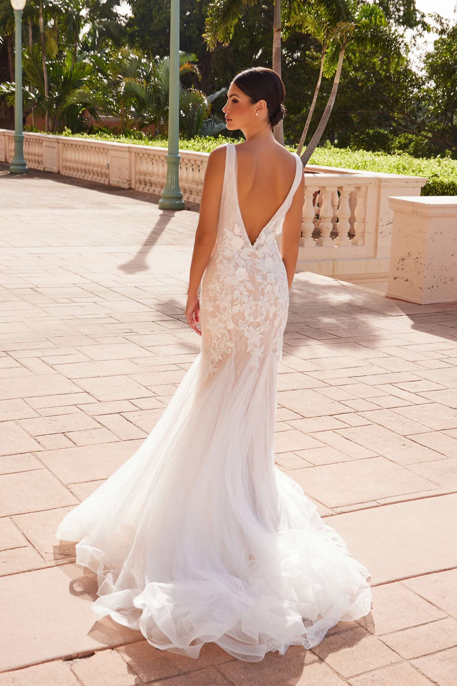 White V-neck mermaid wedding dress with lace front and sheer back panel