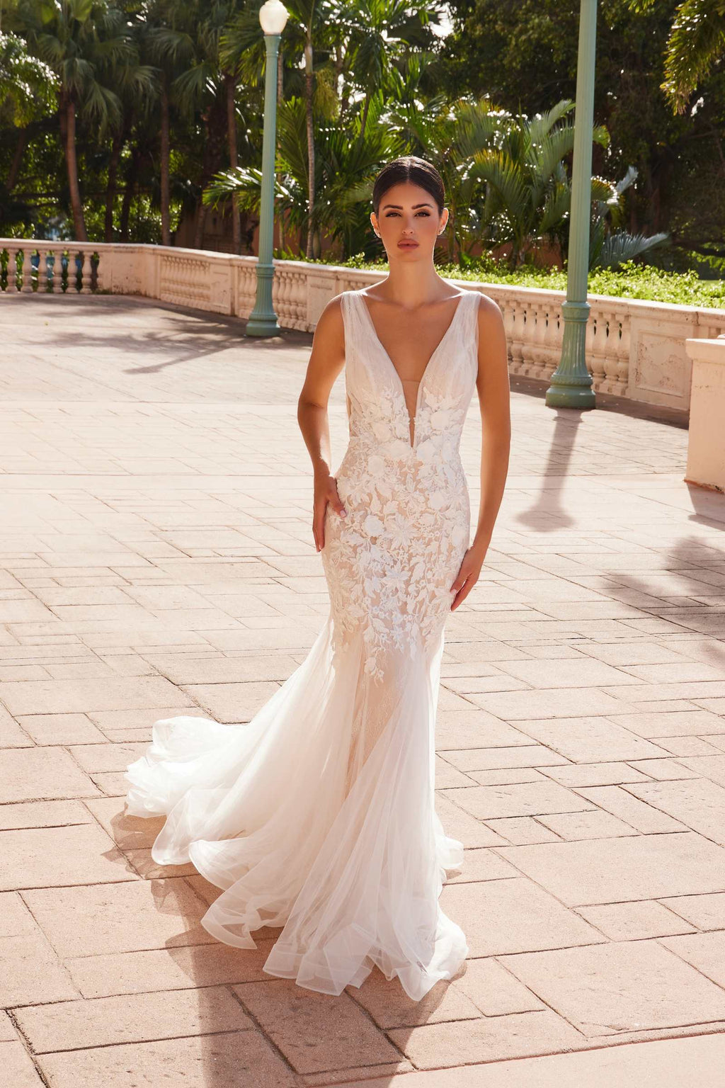 White V-neck mermaid wedding dress with embroidered lace bodice and tulle flounce