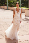 White V-neck mermaid wedding dress with lace bodice and layered tulle skirt