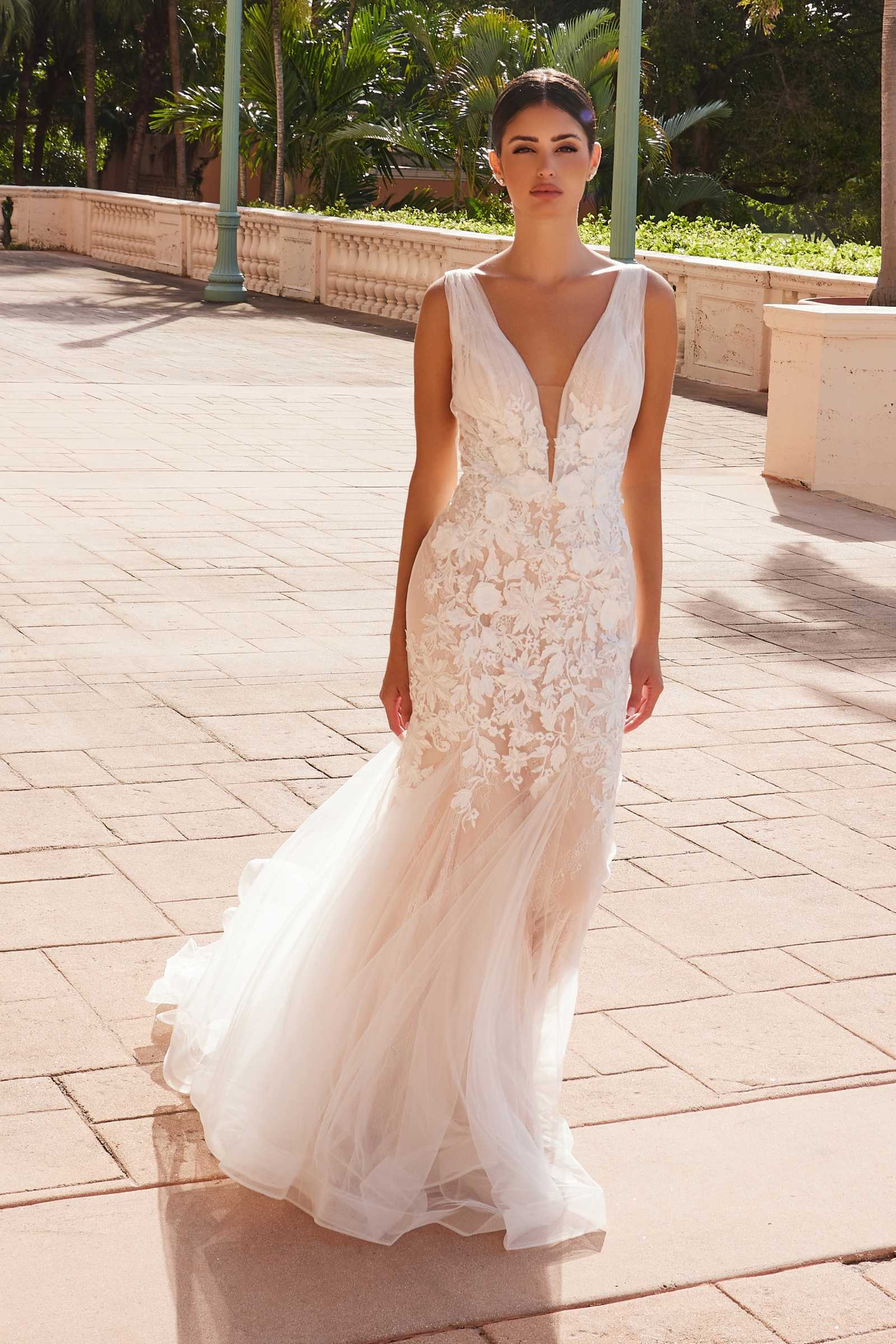 White V-neck mermaid wedding dress with lace bodice and layered tulle skirt