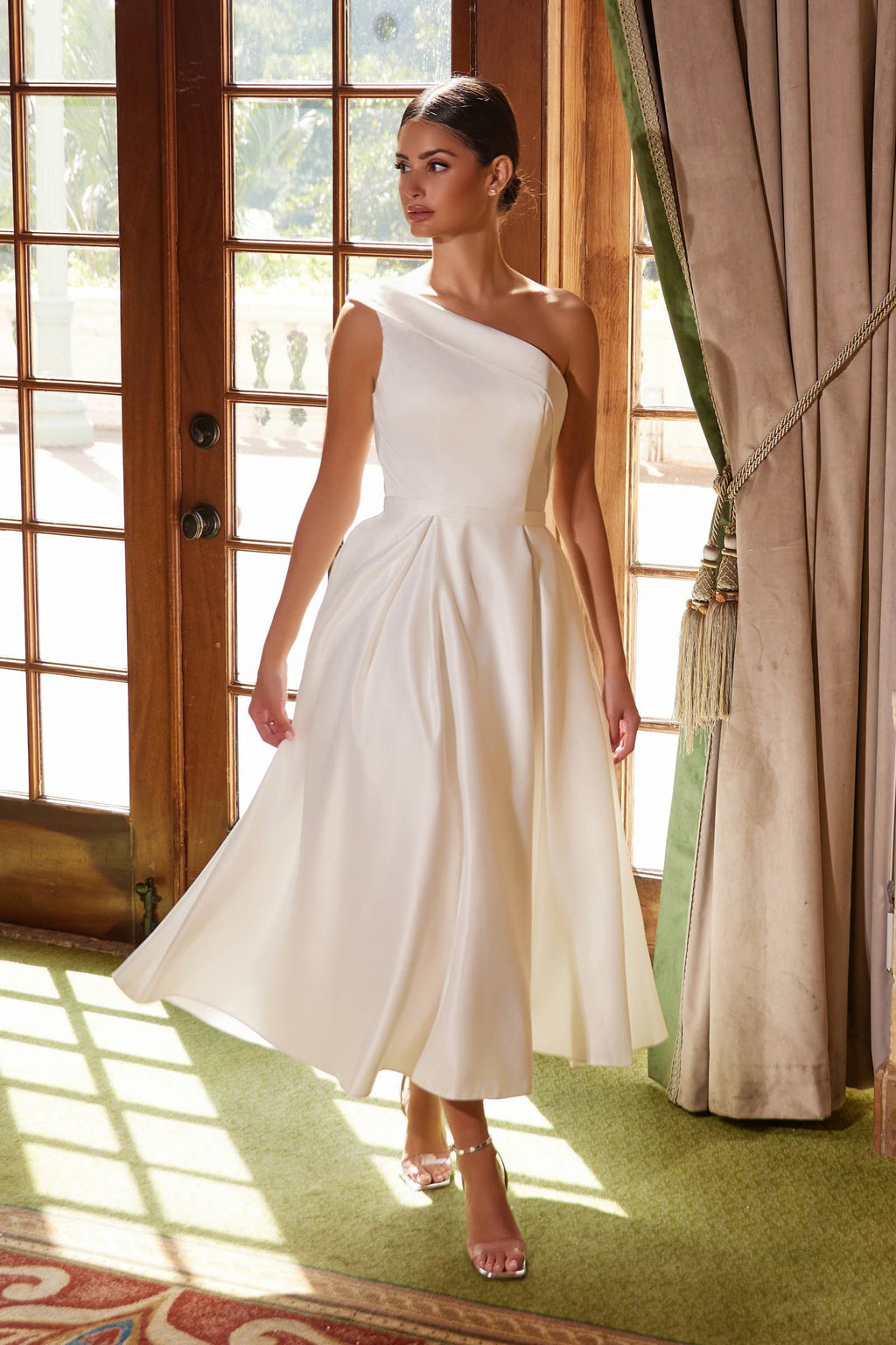 White one-shoulder satin tea-length dress with asymmetrical neckline and flared skirt