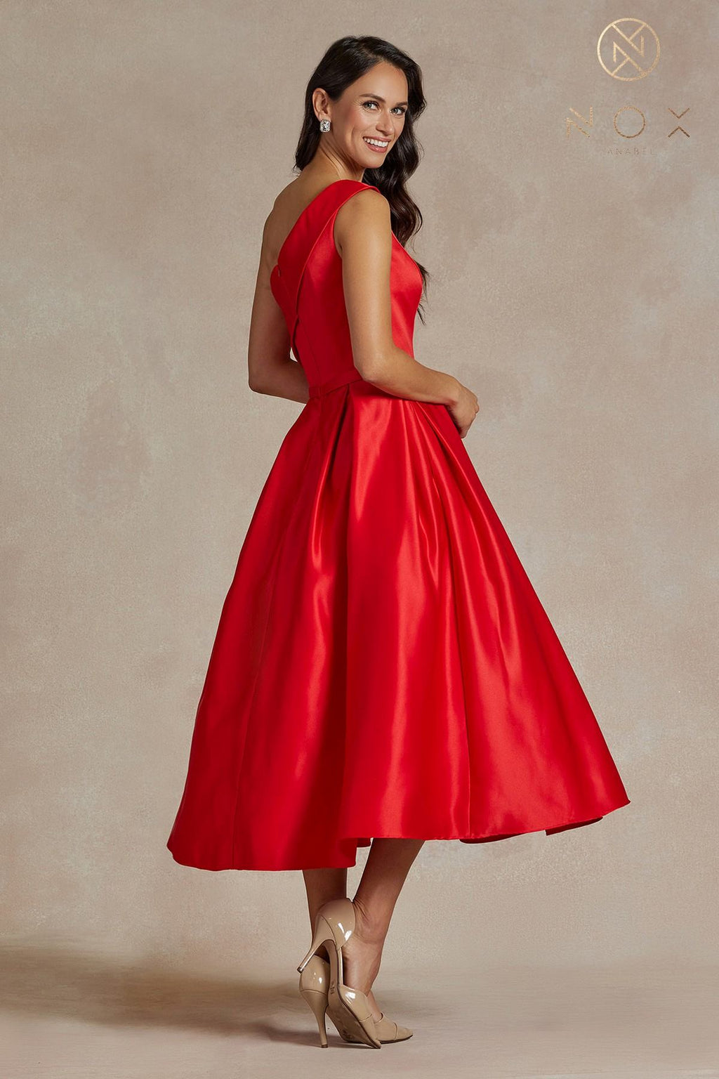 Red one-shoulder satin tea-length gown with fitted waist and flared skirt