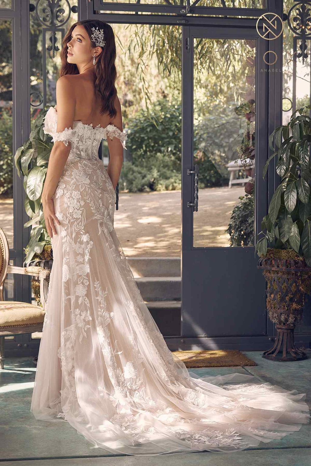 Off-shoulder embroidered wedding gown with fitted bodice, long tulle skirt, side view