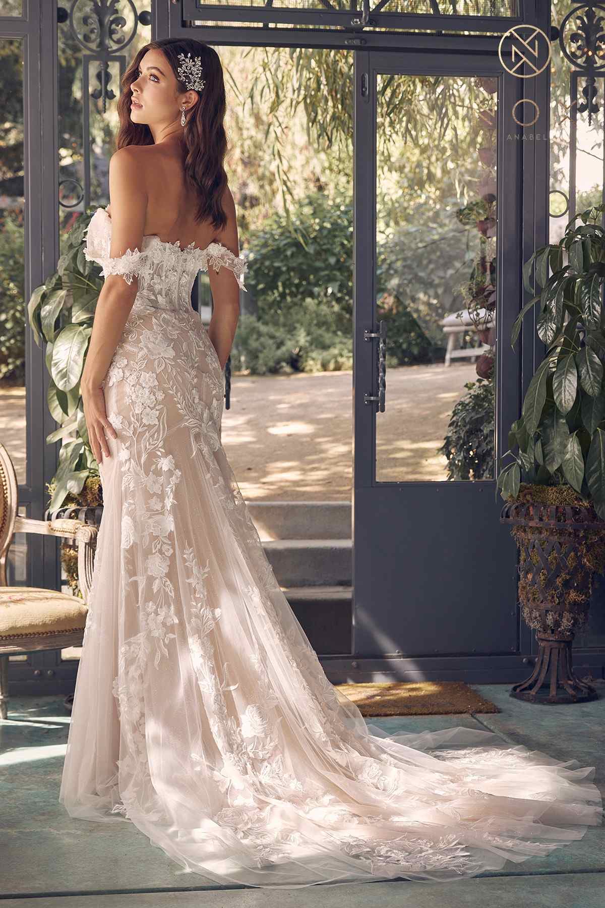 Off-shoulder embroidered wedding gown with fitted bodice, long tulle skirt, side view