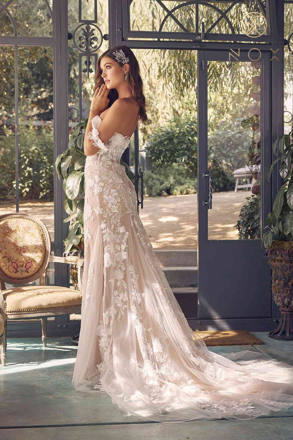 Off-shoulder embroidered wedding gown, long tulle skirt with floral embroidery, standing pose