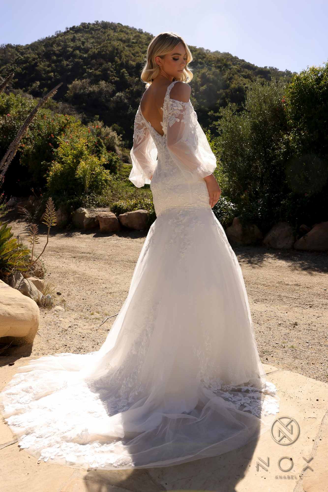 White lace mermaid bridal gown, sheer long bell sleeves, fitted skirt