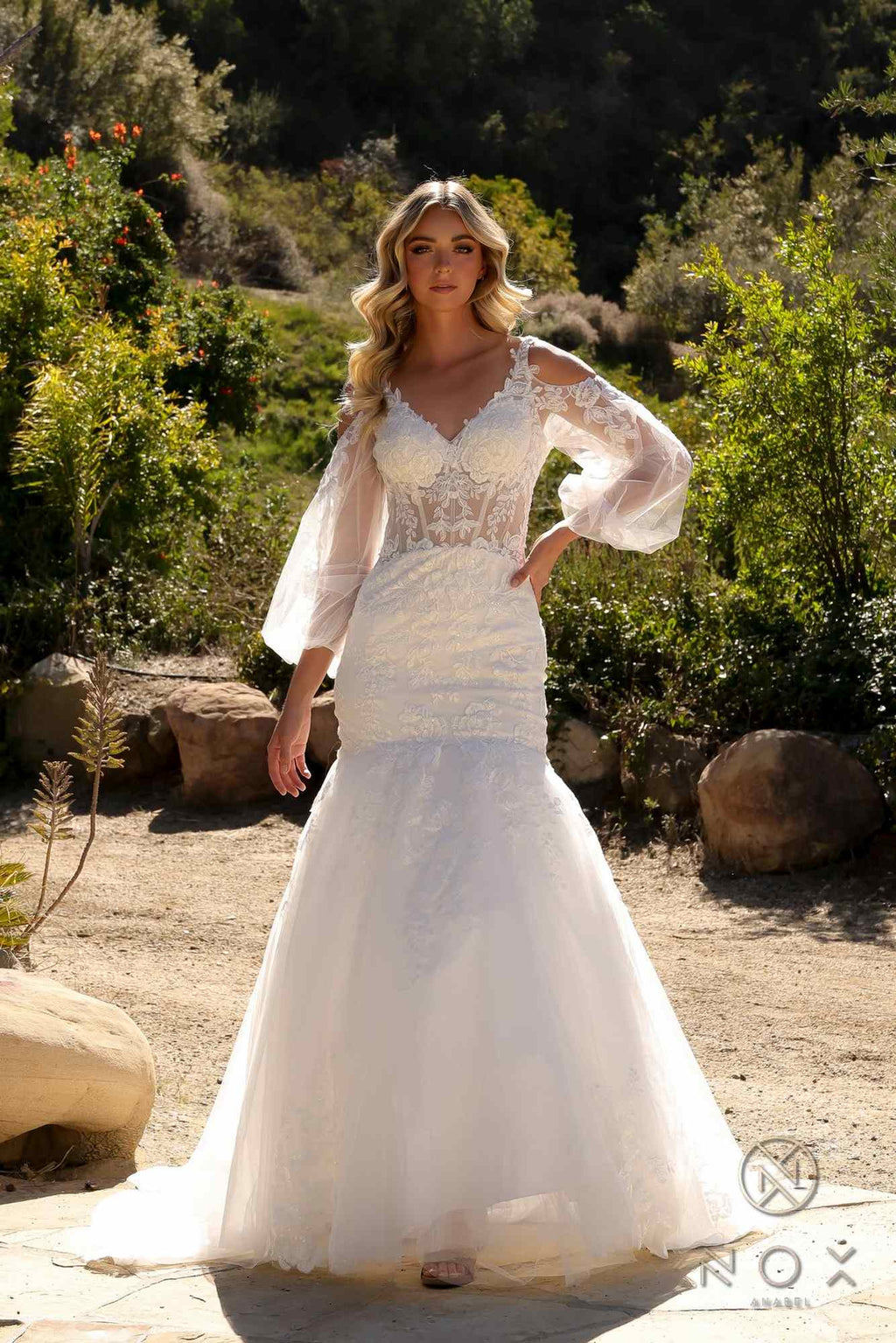 White lace mermaid bridal gown with scalloped V-neck and sheer bell sleeves