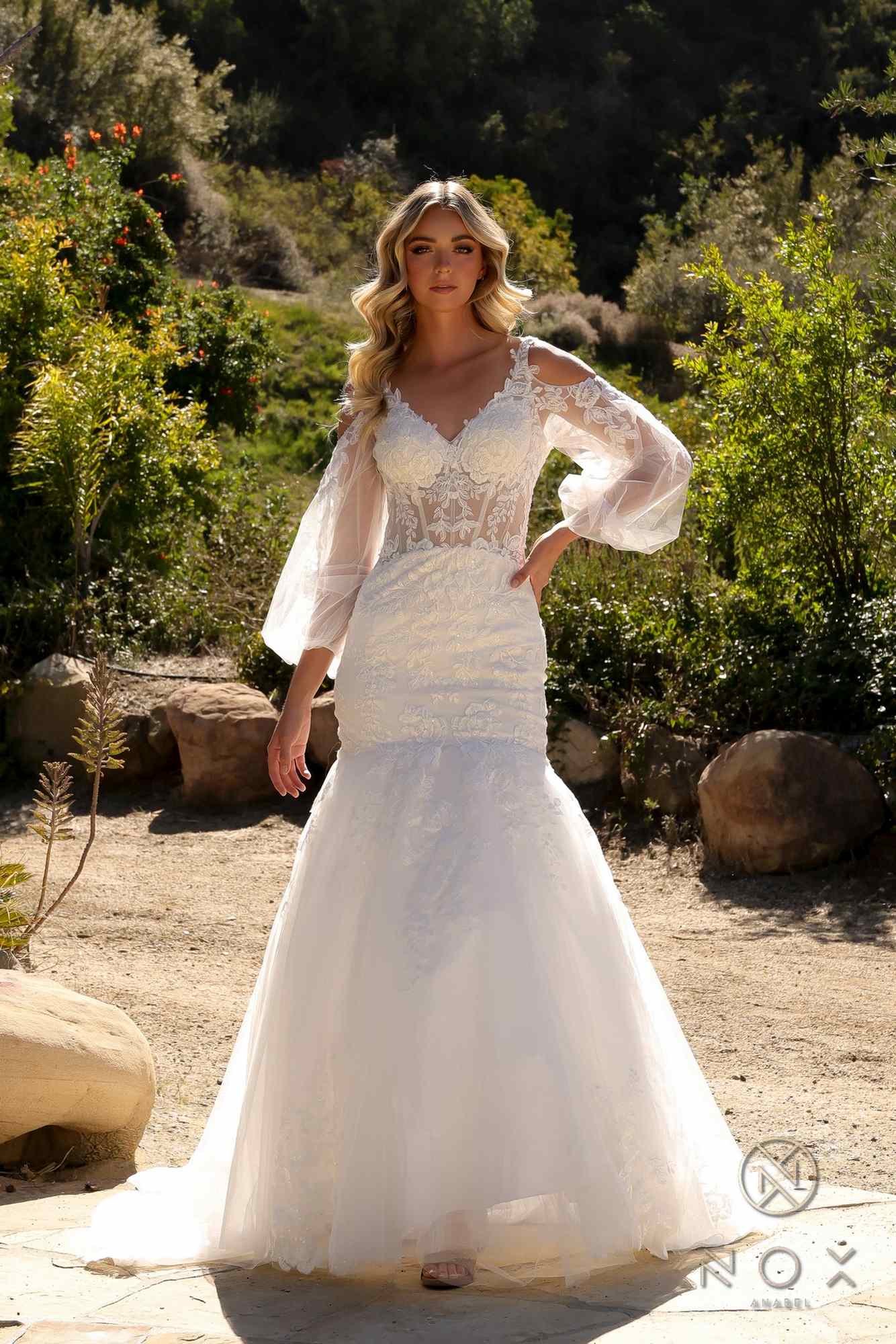 White lace mermaid bridal gown with scalloped V-neck and sheer bell sleeves