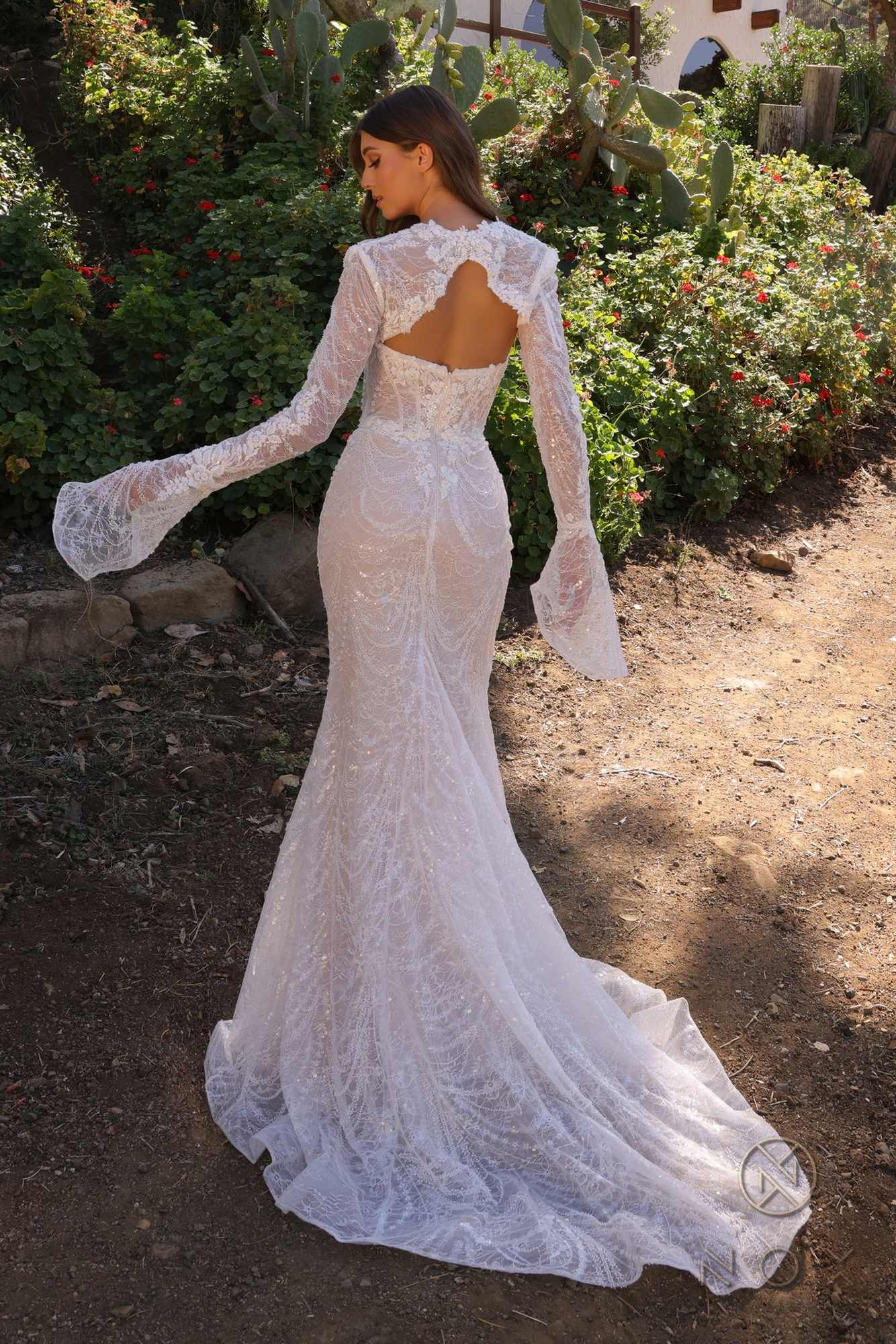 Fitted bridal gown in white lace, long sleeves, low open back, flared mermaid hem