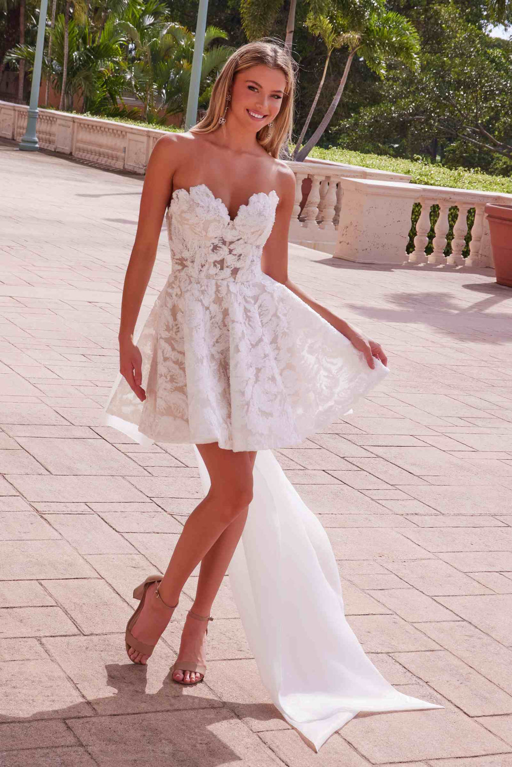 White lace strapless sweetheart dress with textured bodice, flared skirt, long train