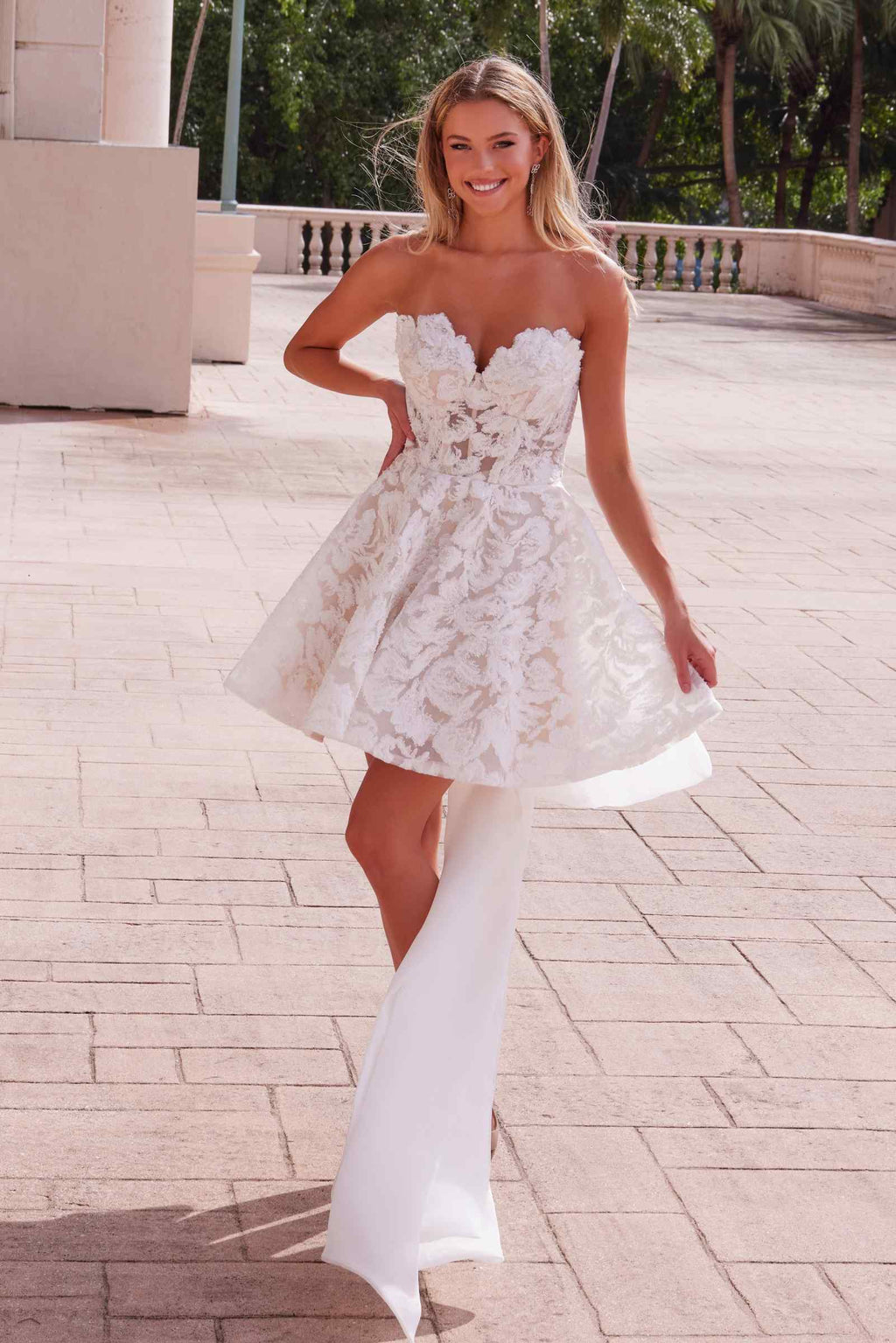 White lace strapless sweetheart mini dress with flared skirt and long sheer drape