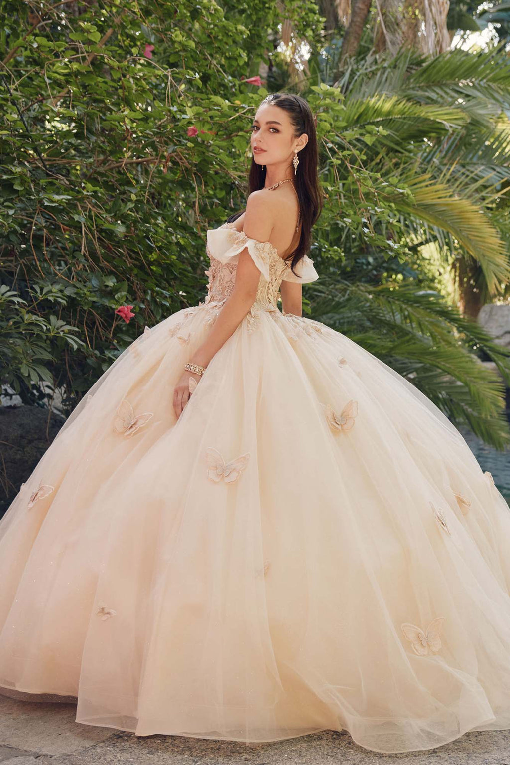 Champagne off-shoulder ball gown with lace bodice, ruffled sleeves, and full tulle skirt