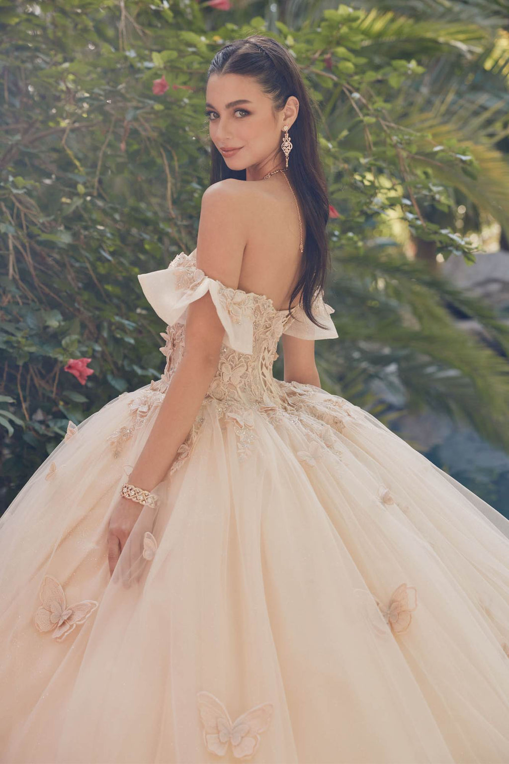 Champagne off-shoulder ball gown with puff sleeves, lace-up bodice, and flared tulle skirt