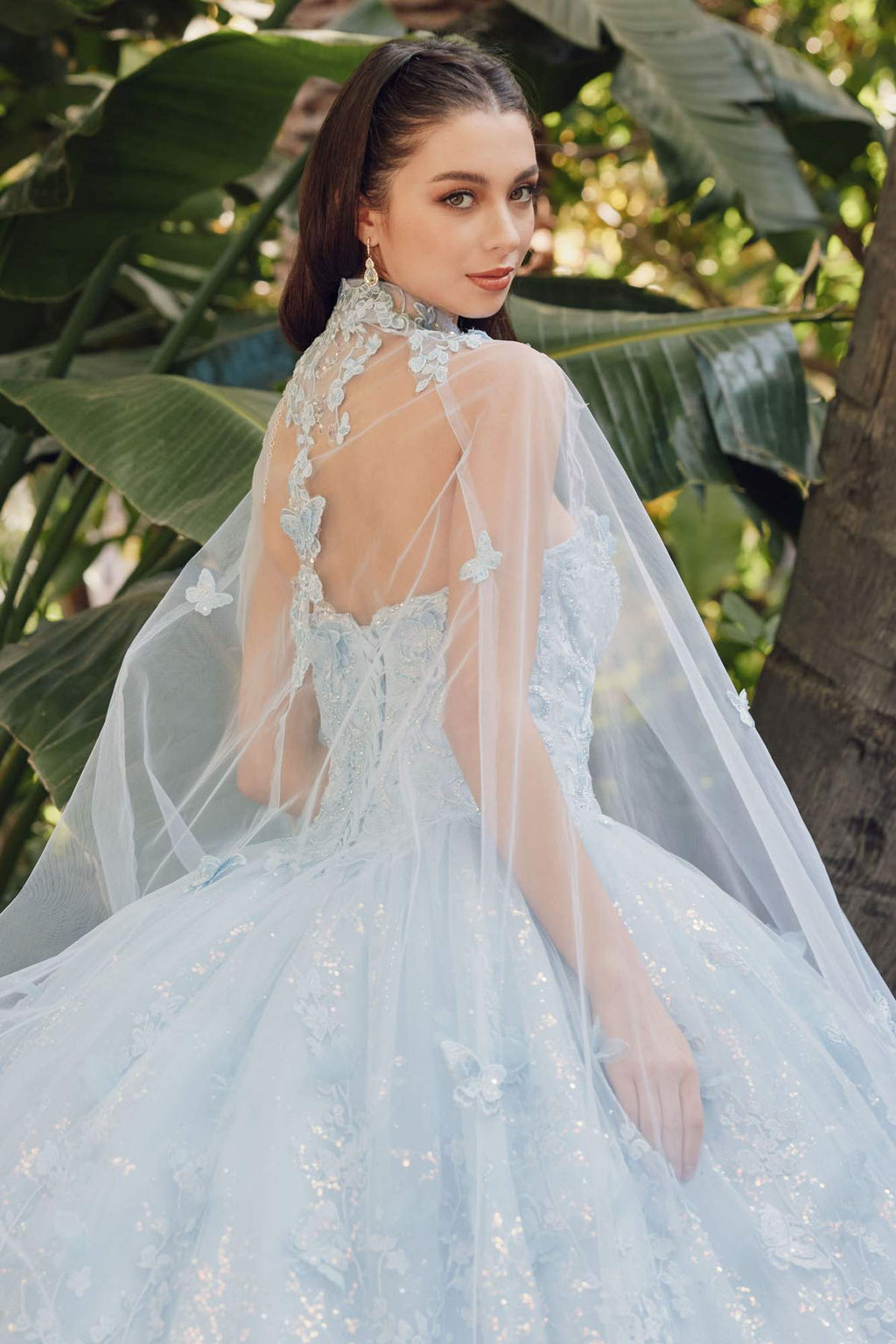 Light blue strapless gown with sweetheart neckline and sheer cape, fitted lace bodice