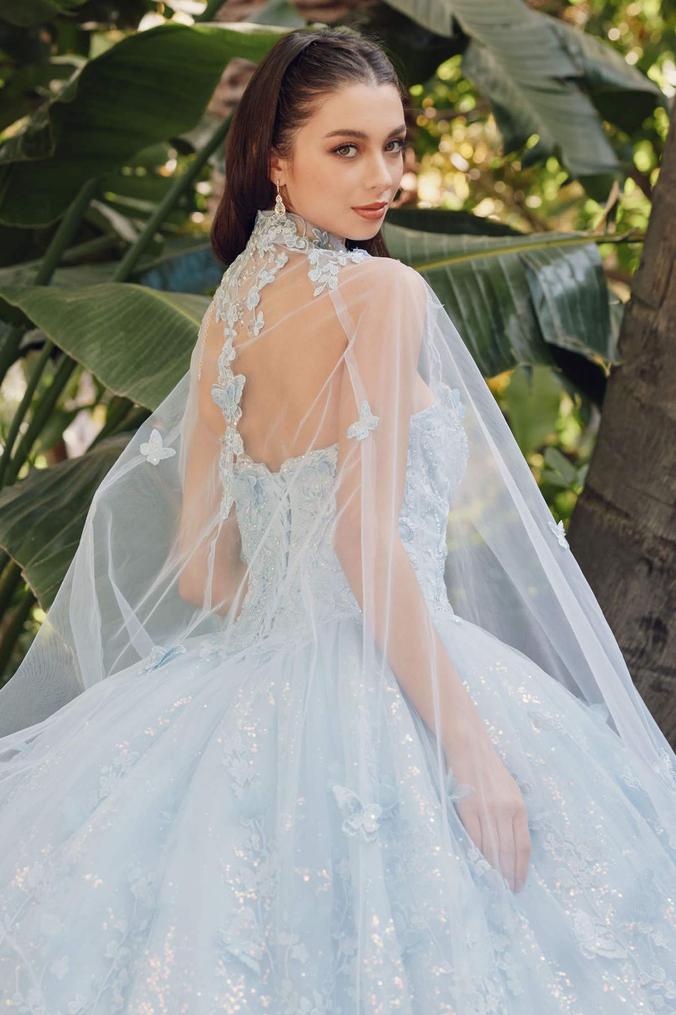 Light blue strapless gown with sweetheart neckline and sheer cape, fitted lace bodice