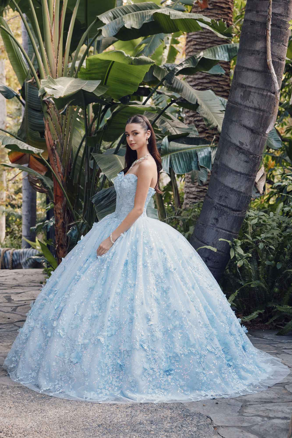 Light blue strapless sweetheart gown with cape and full poofy skirt, angled view