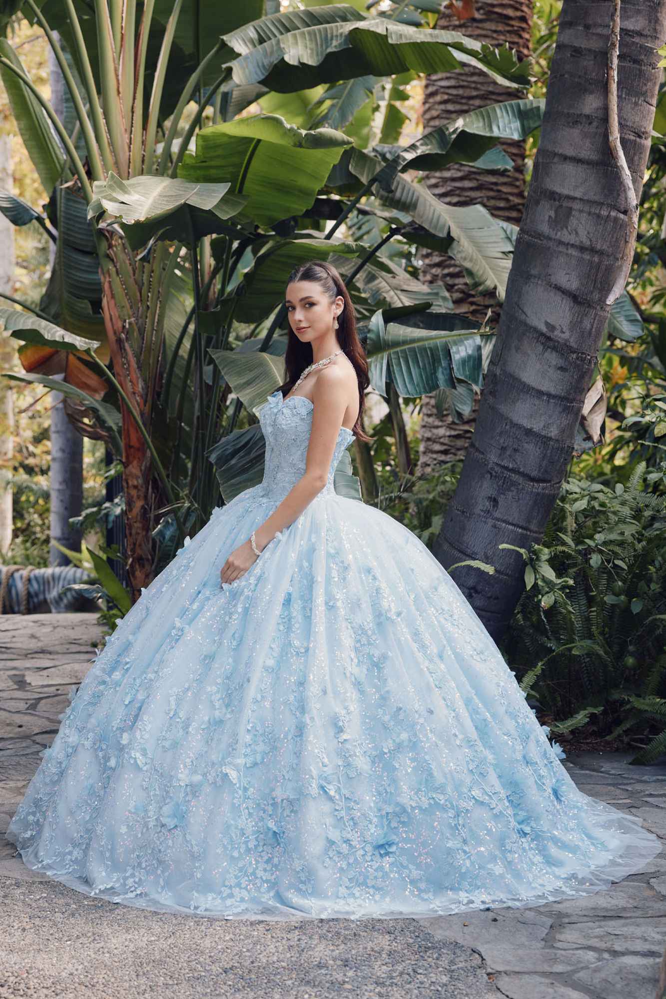 Light blue strapless sweetheart gown with cape and full poofy skirt, angled view