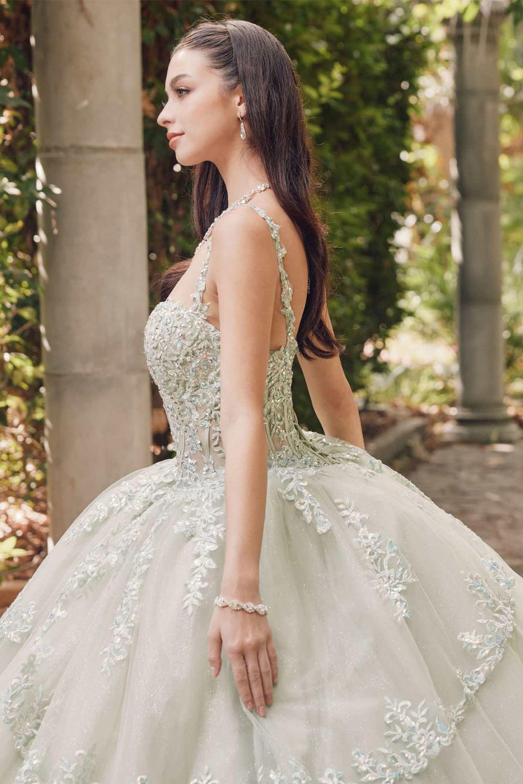 Sweetheart corset ball gown with lace appliques, fitted bodice, and tiered skirt