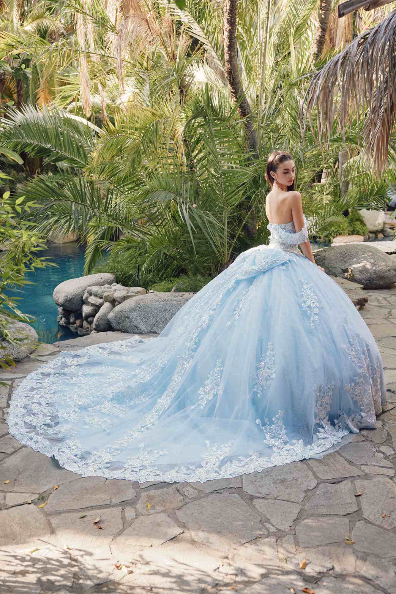 Light blue off-shoulder quince dress with draped sleeves and cathedral train
