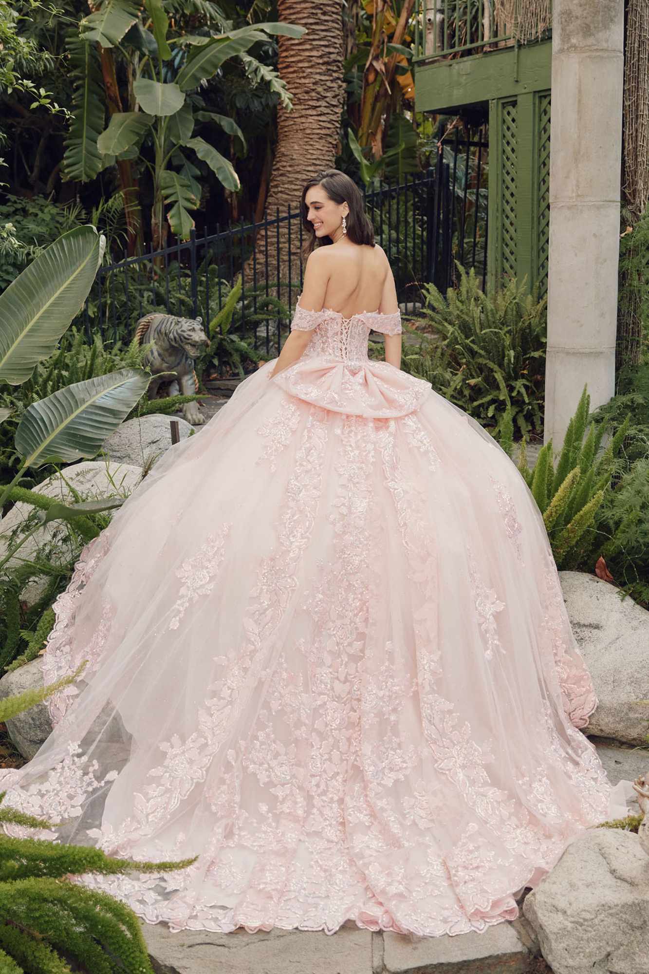 Blush quince ball gown with off-shoulder lace bodice, tiered skirt and long train