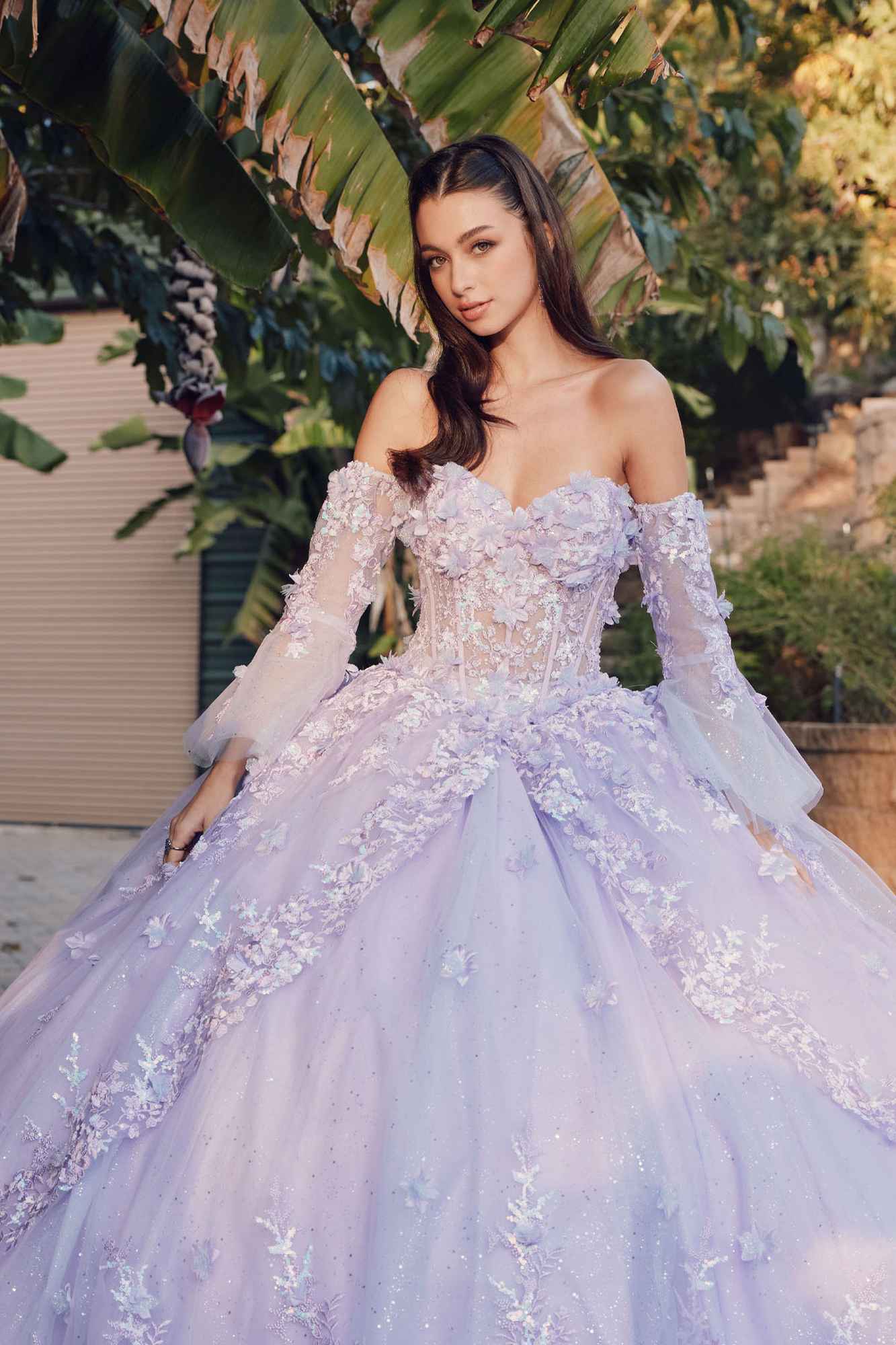 Lilac strapless ball gown with lace bodice and flowing tulle skirt, off-shoulder bell sleeves