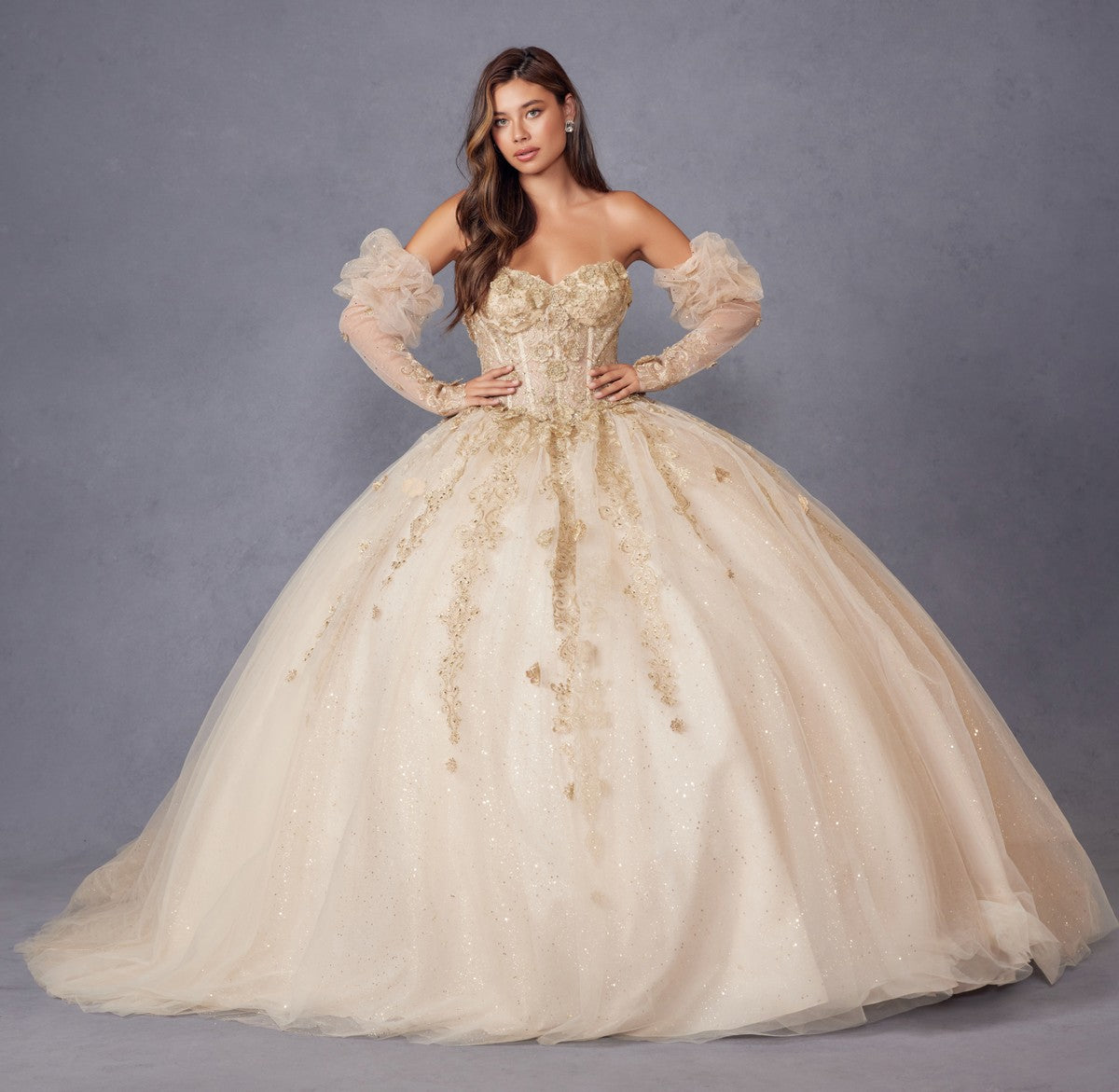 Champagne quinceanera ball gown with 3D flower bodice, puff sleeves, and sparkling tulle skirt