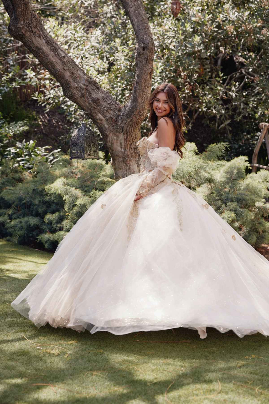Champagne quinceanera dress with puff sleeves, corset bodice, and full tulle skirt