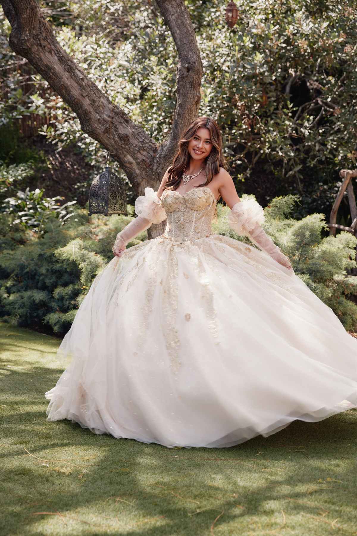 Champagne quinceanera dress with 3D flower appliques, puff sleeves, and full tulle skirt