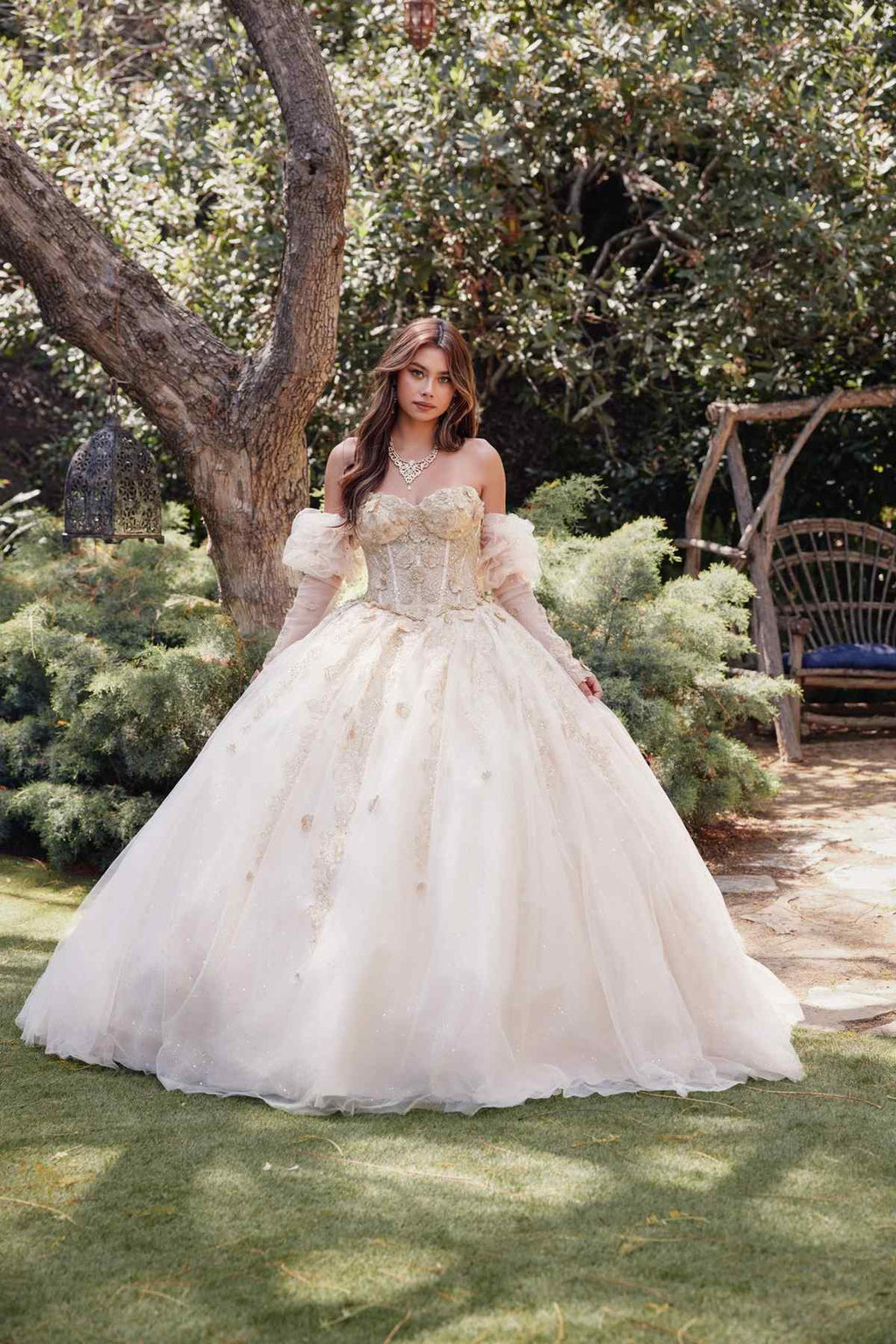 Champagne ball gown quinceanera dress with 3D flower appliques, puff sleeves, and layered skirt