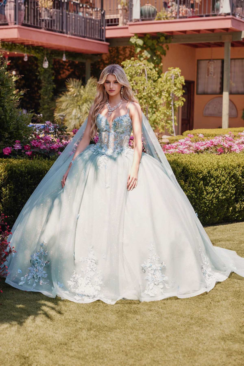 Sage green ballgown dress with floral applique details and cape sleeves, full skirt