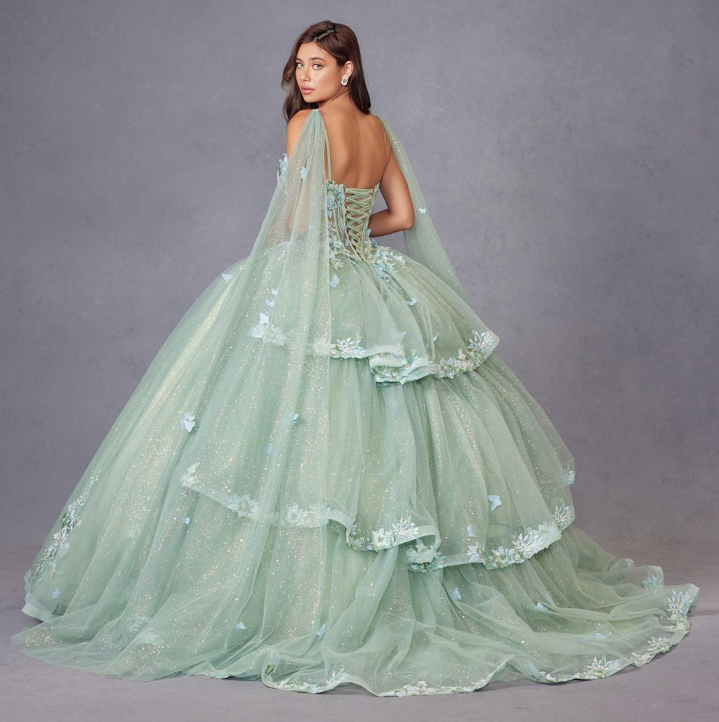 Sage green ballgown with tiered skirt, floral appliques, and sheer cape sleeves