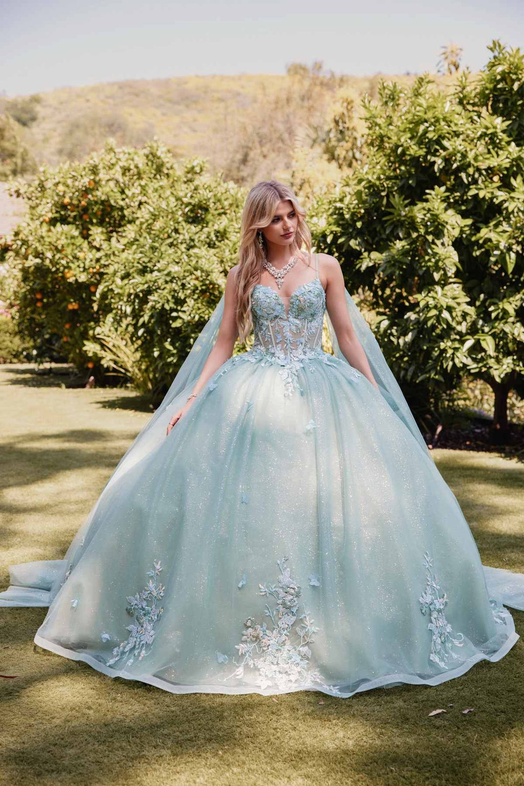 Sage green ballgown with 3D floral appliques on bodice and cape sleeves, full length