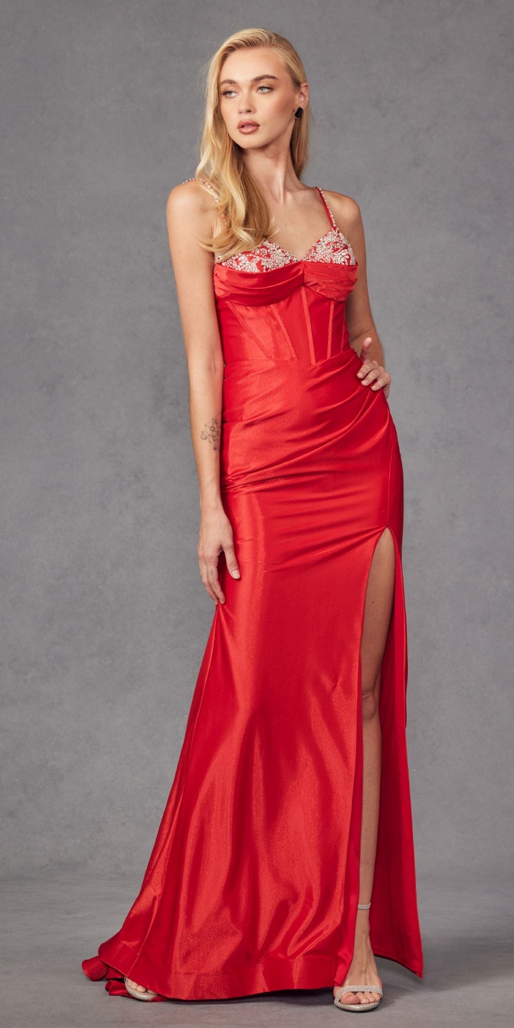 Embellished corset mermaid gown, bright red satin, lace-trimmed neckline, long slit